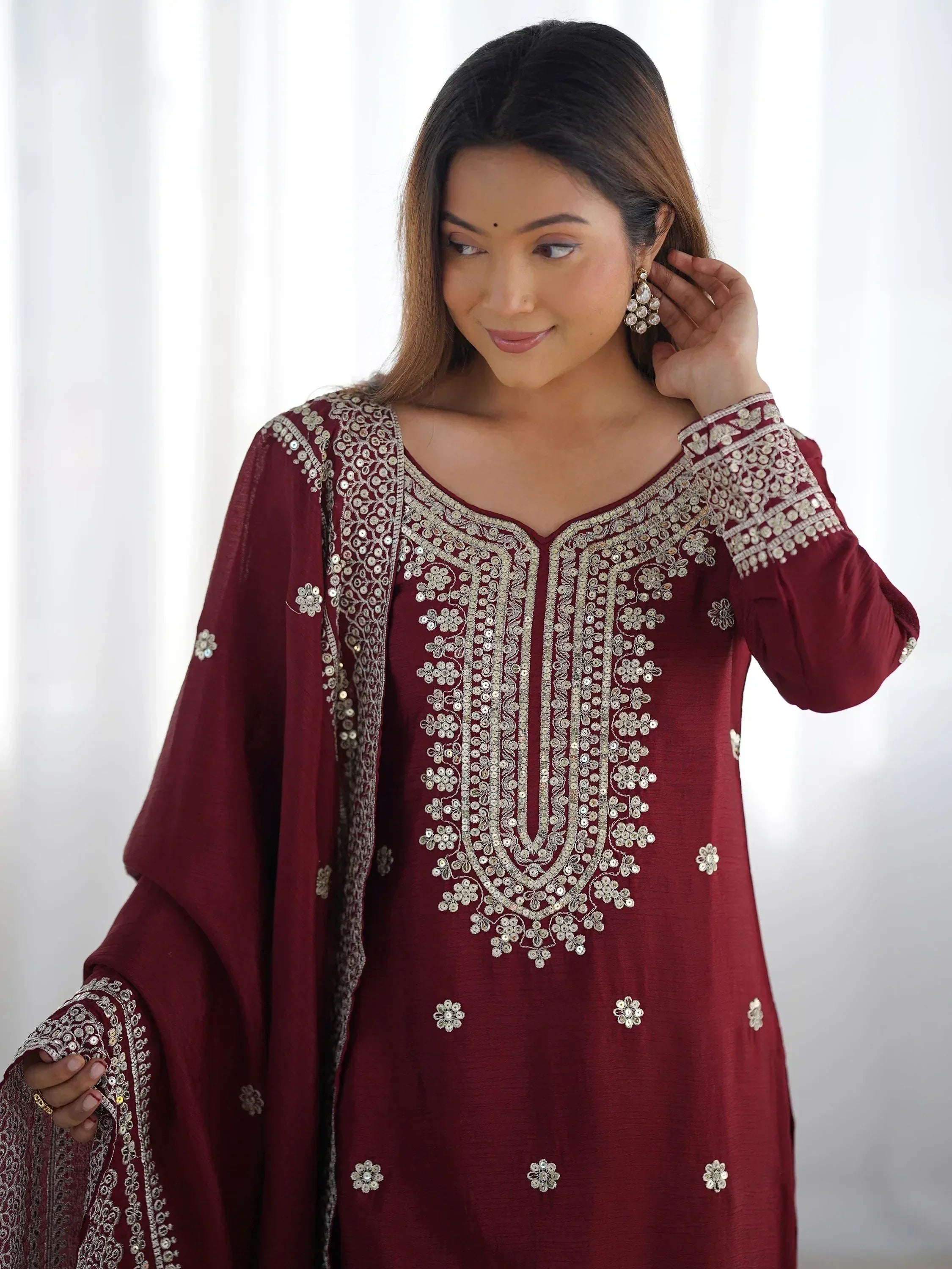 Maroon ethnic kurti with silver embroidery and mirror work, paired with matching dupatta for festive occasions