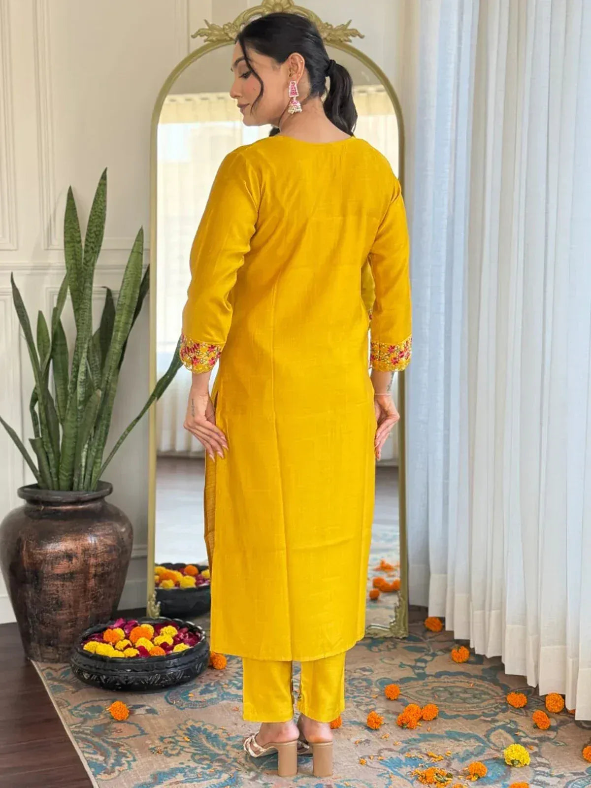 Yellow ethnic kurta with floral cuff embroidery, paired with matching pants, perfect for Indian festive occasions.