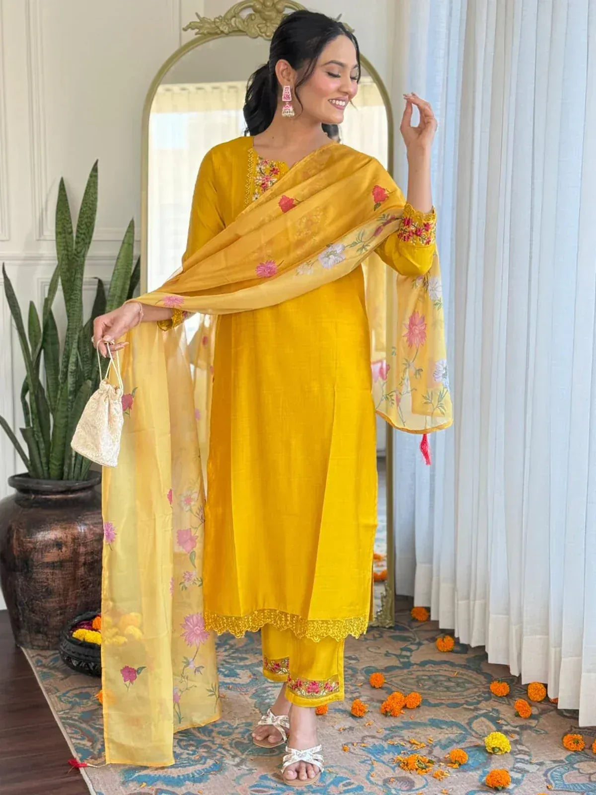 Yellow floral embroidered salwar kameez with matching dupatta, perfect for festive occasions