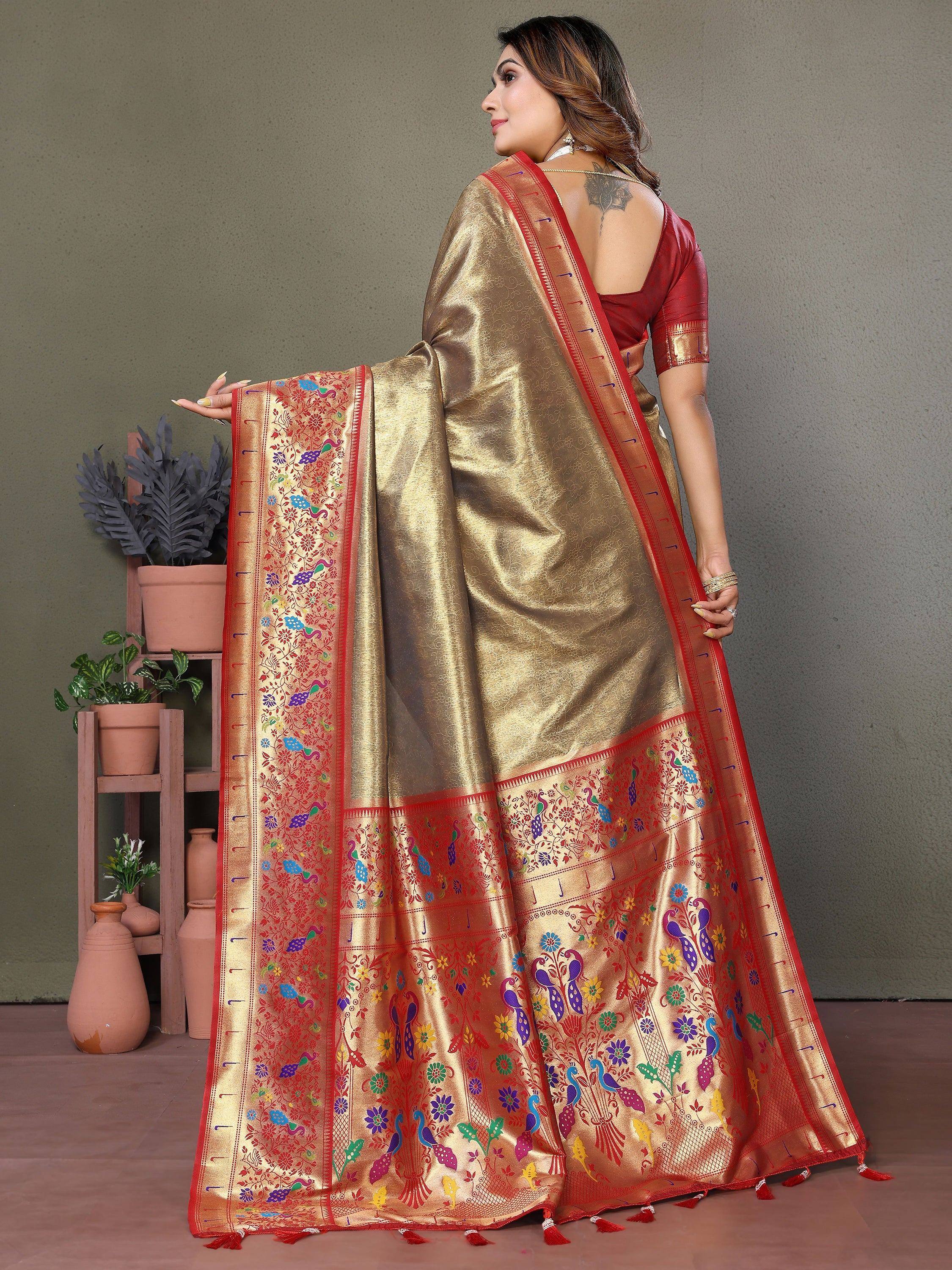 Golden saree with colorful peacock and floral embroidery, paired with red blouse for ethnic wear