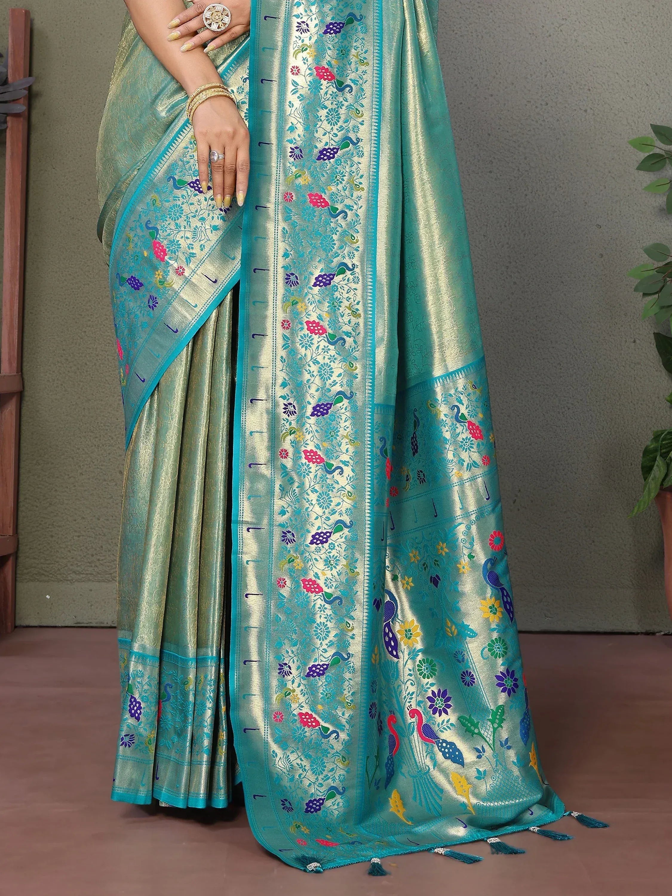 Teal saree with peacock and floral embroidery, perfect for ethnic occasions
