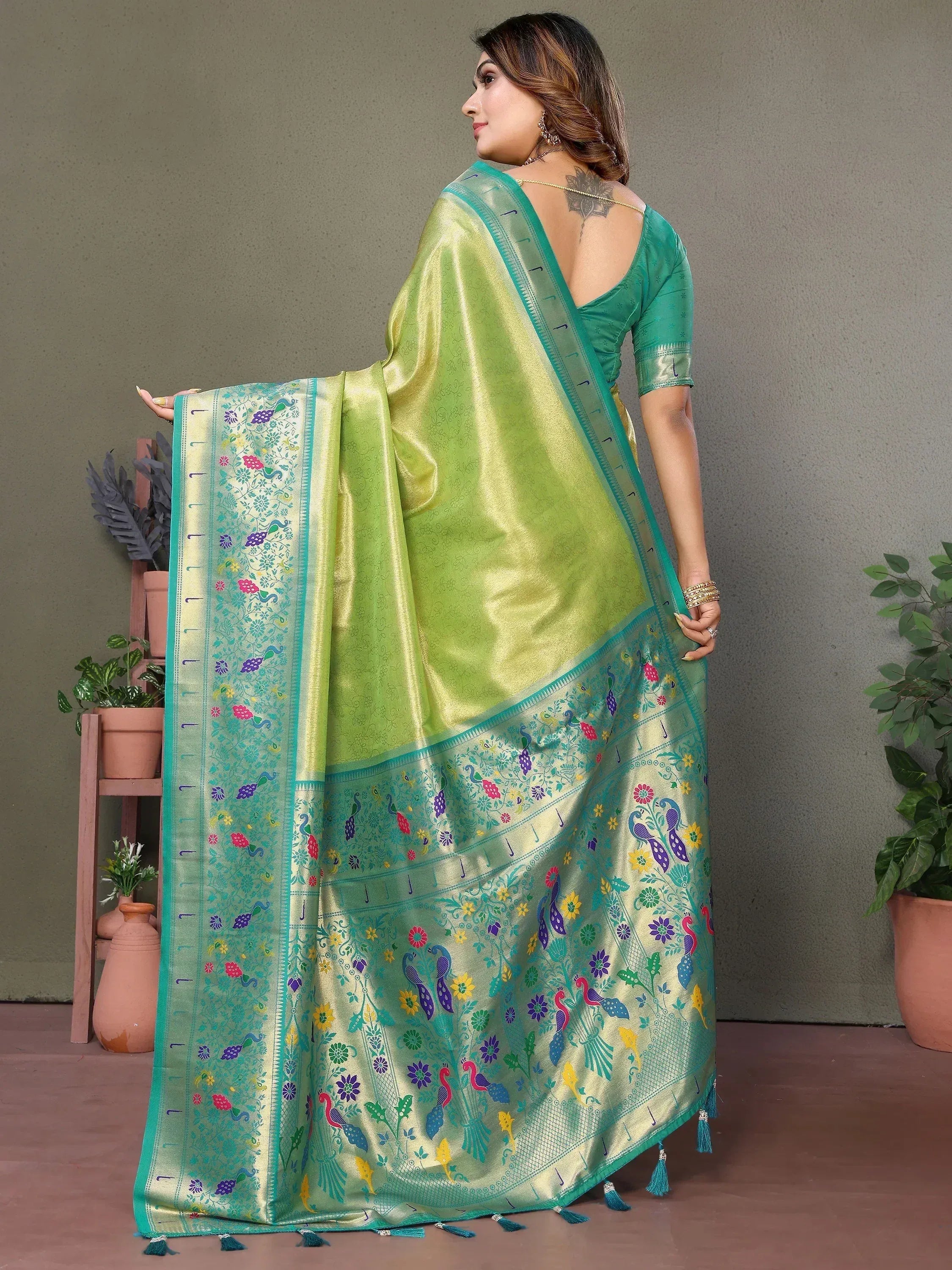 Green saree with peacock and floral embroidery, perfect for Indian ethnic wear