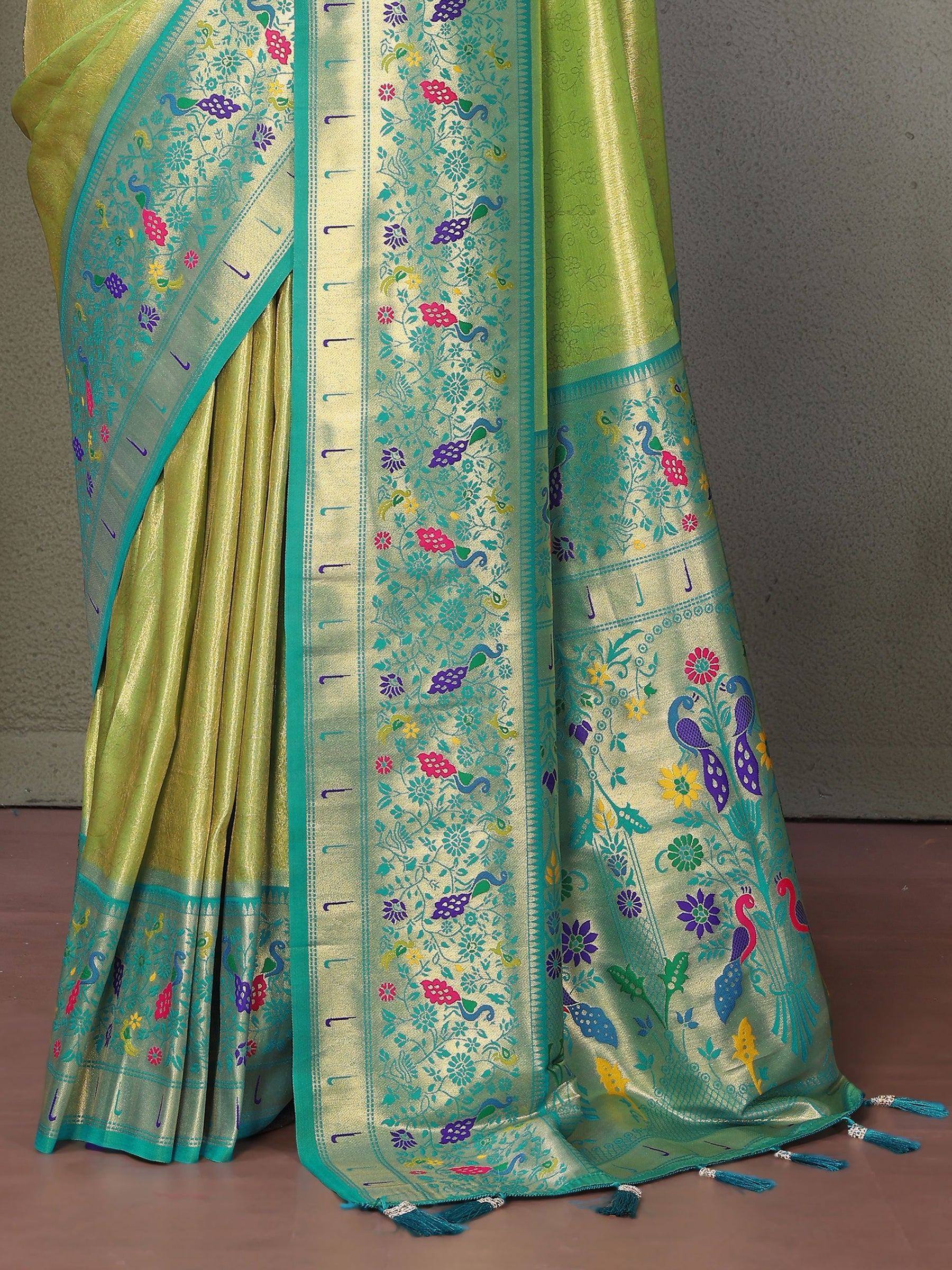 Vibrant green saree with peacock and floral embroidery, perfect for ethnic occasions