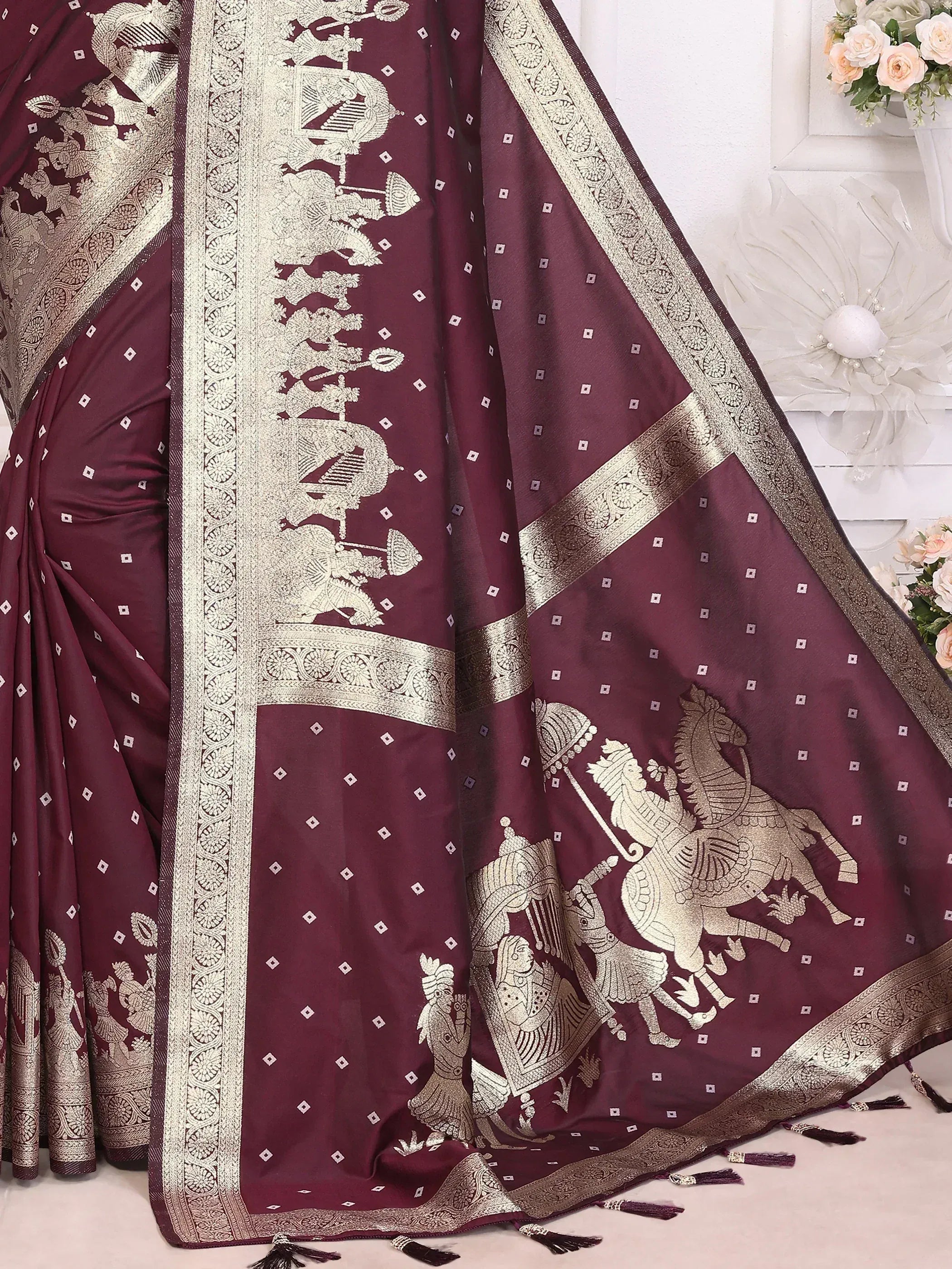 Maroon saree with gold warrior horse embroidery and intricate border design