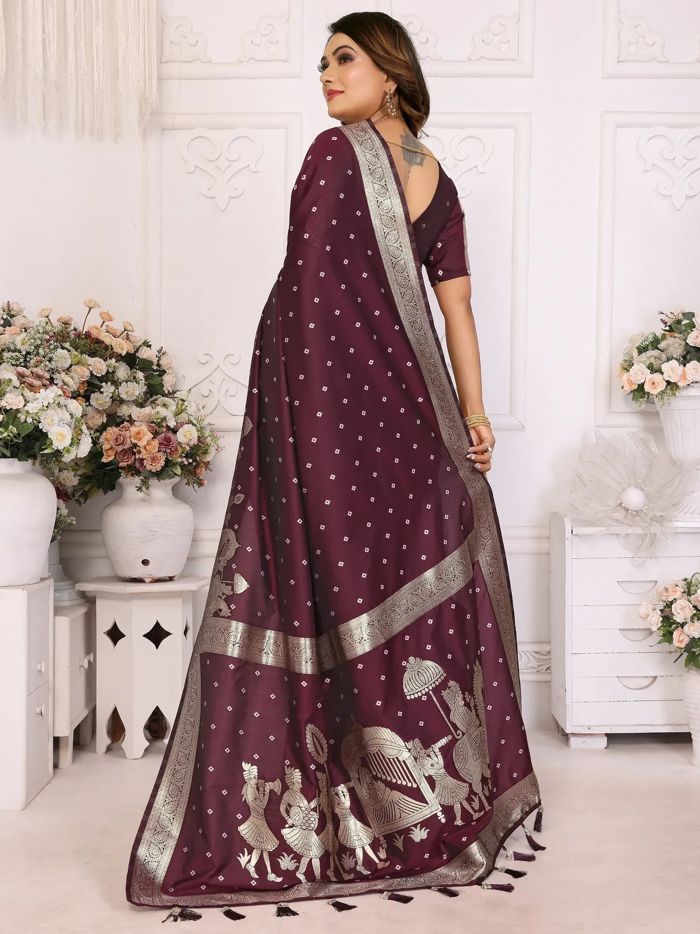 Elegant maroon saree with gold embroidery and traditional motifs, perfect for ethnic occasions.