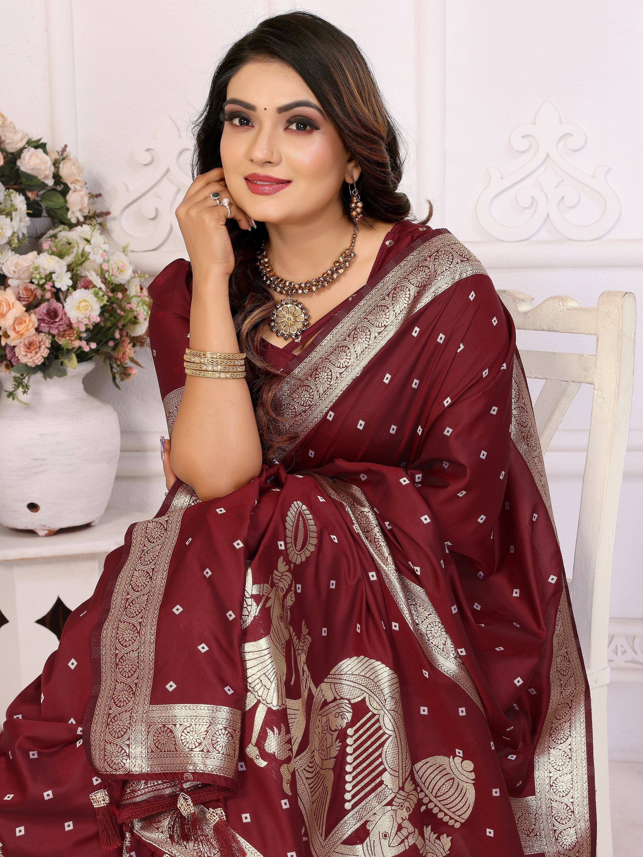 Maroon designer saree with gold embroidery, perfect for ethnic occasions and festive wear.