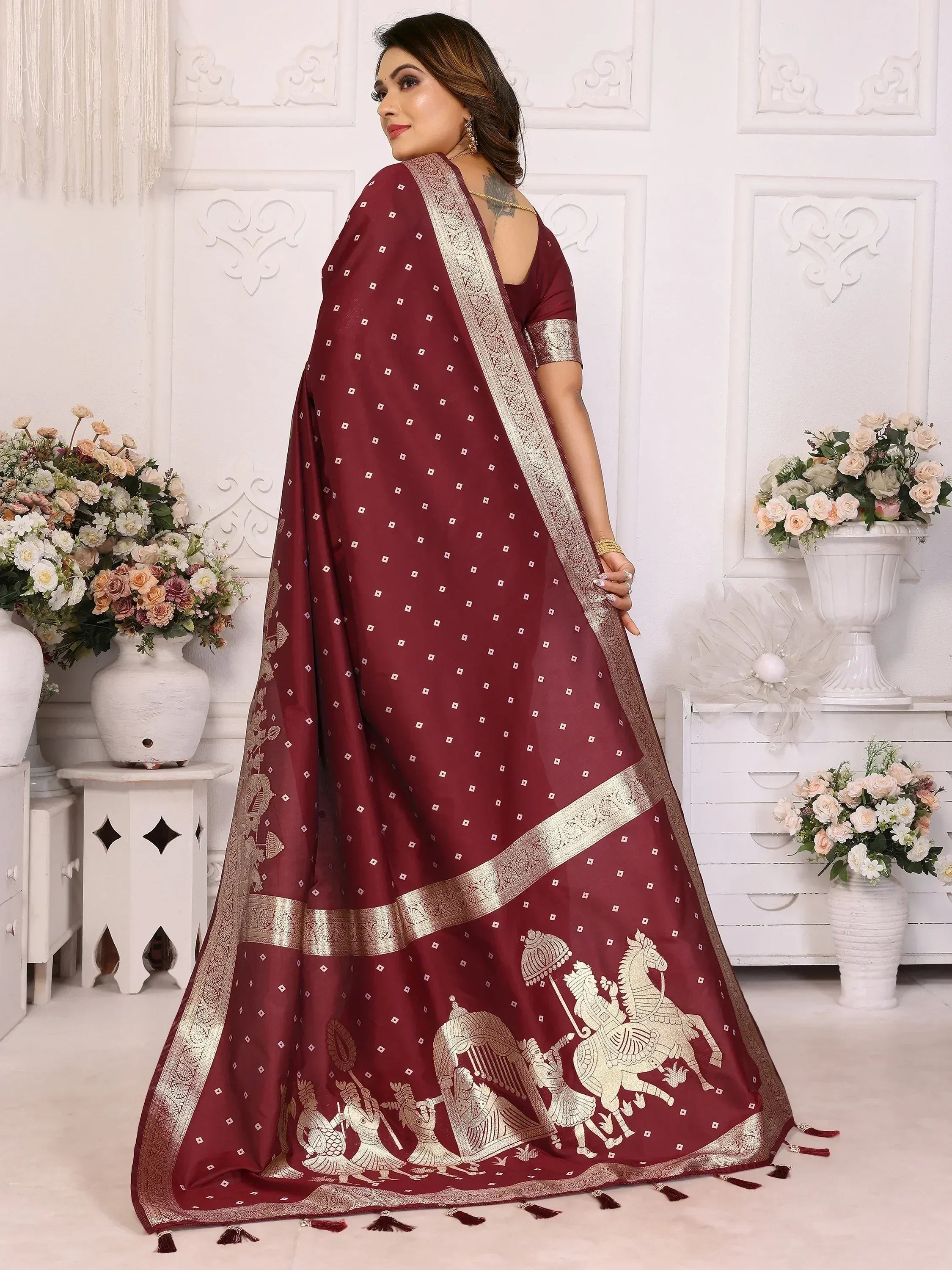 Maroon saree with gold horse motifs and intricate border, perfect for ethnic occasions