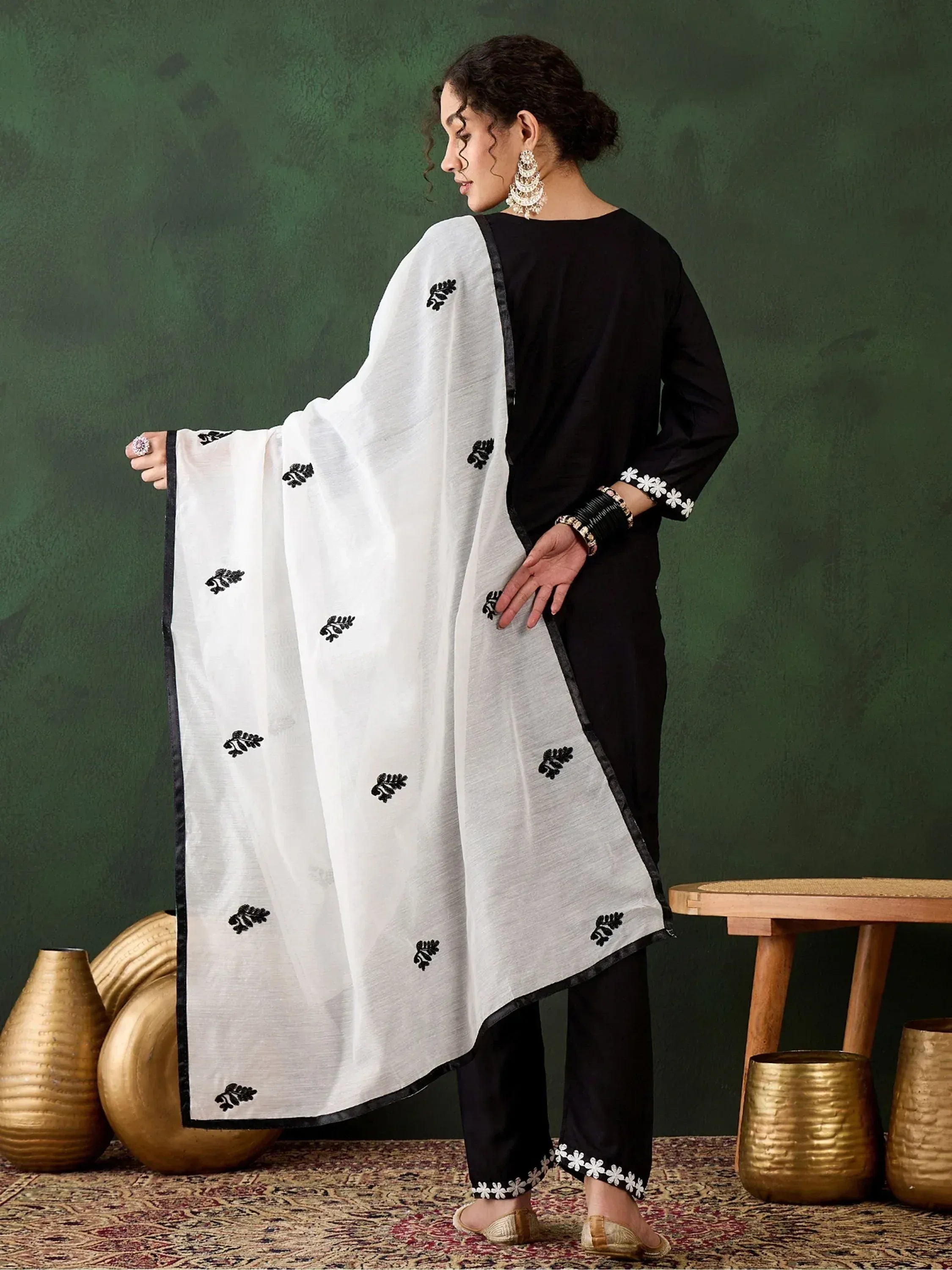 Black and white embroidered salwar kameez with floral detailing, perfect for ethnic wear
