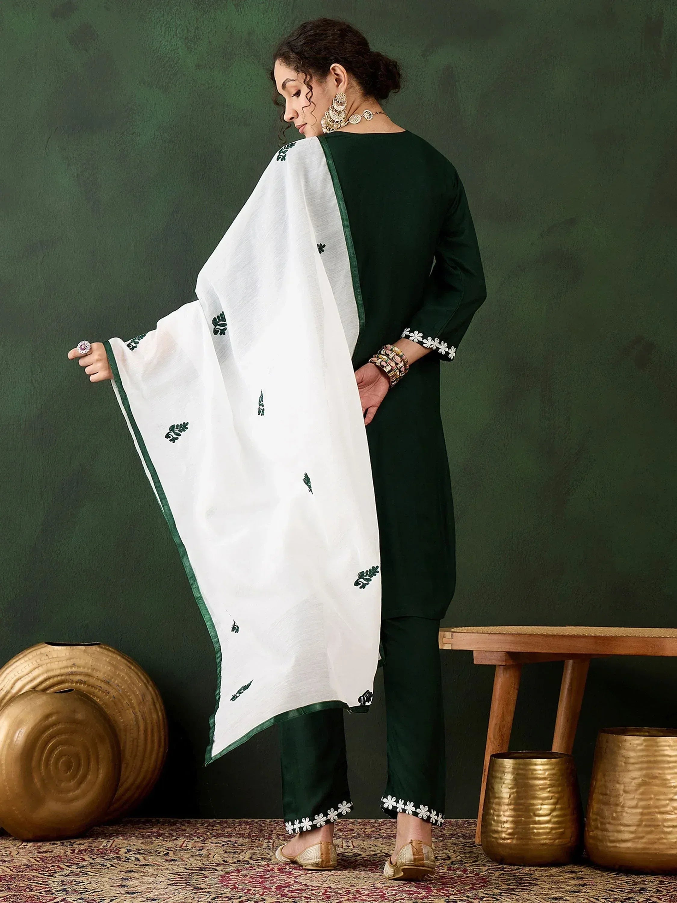 Green and white embroidered salwar kameez with floral detailing, perfect for ethnic wear occasions