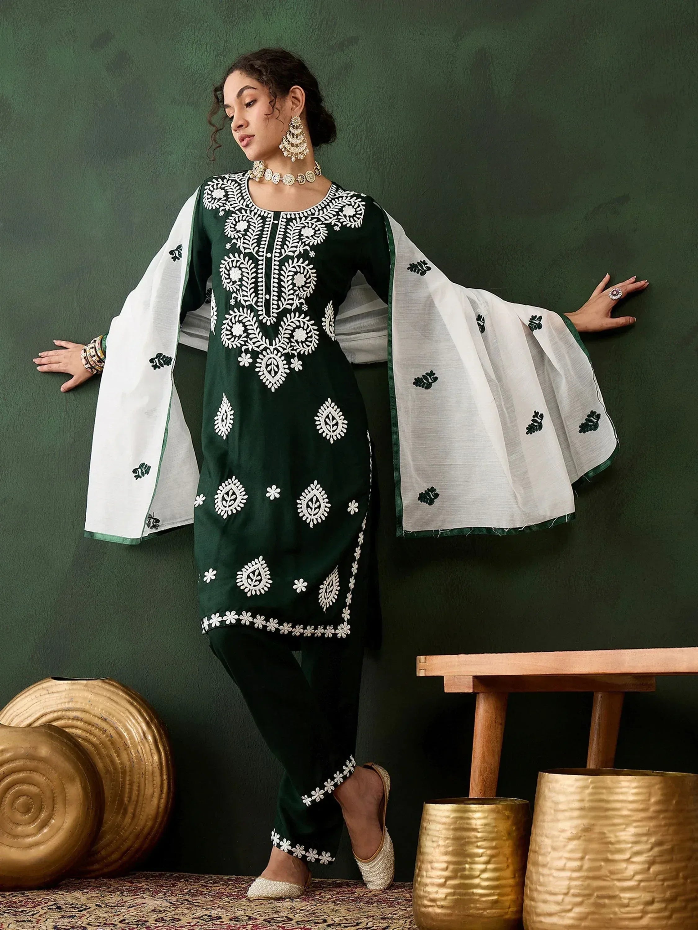 Green embroidered kurta with white bell sleeves, matching pants, and traditional Indian ethnic wear
