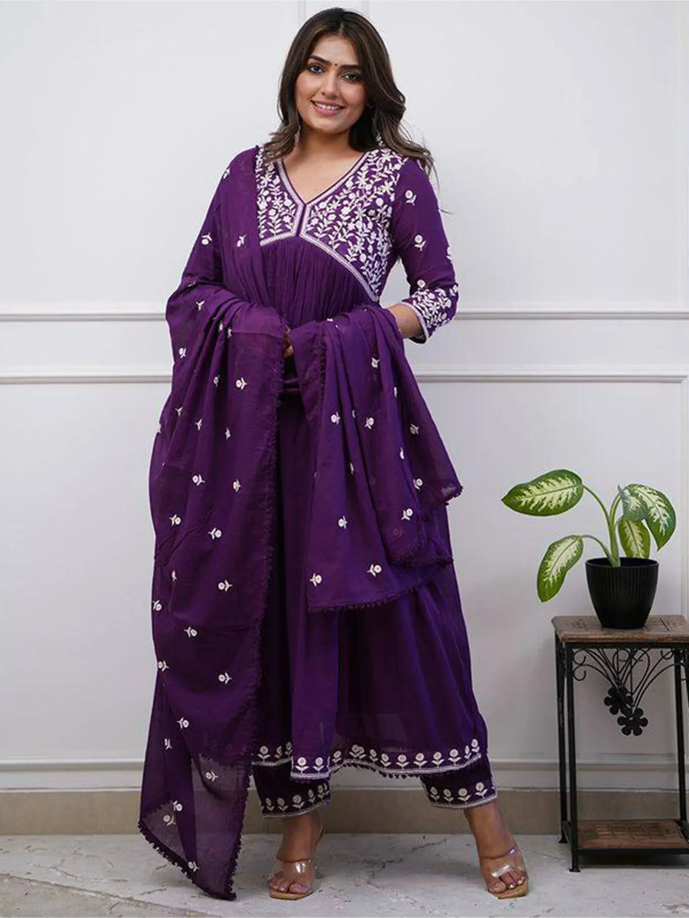 Purple embroidered salwar kameez with floral detailing, perfect for Indian ethnic wear occasions