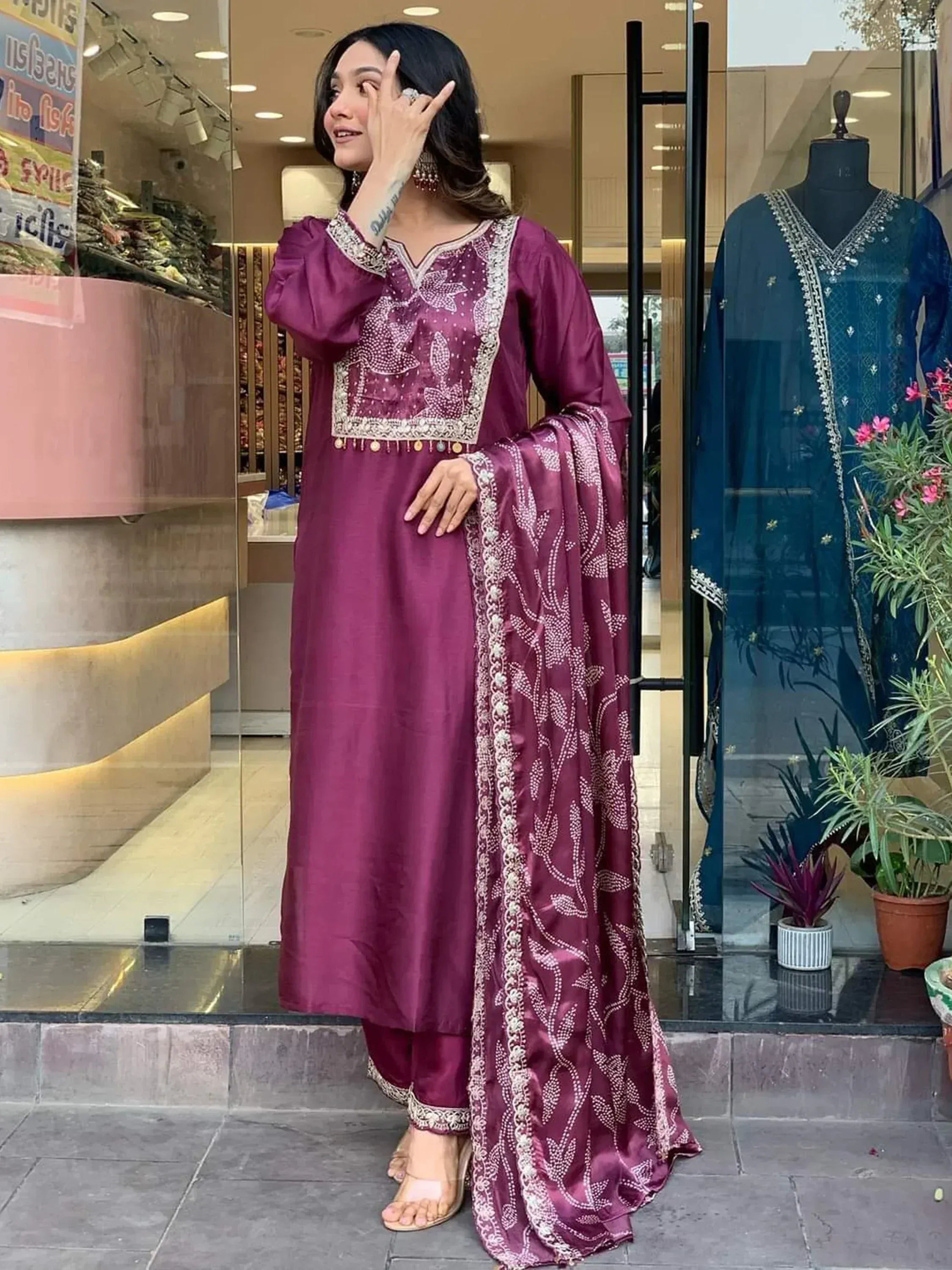 Woman in maroon embroidered salwar kameez with matching dupatta, Indian ethnic wear
