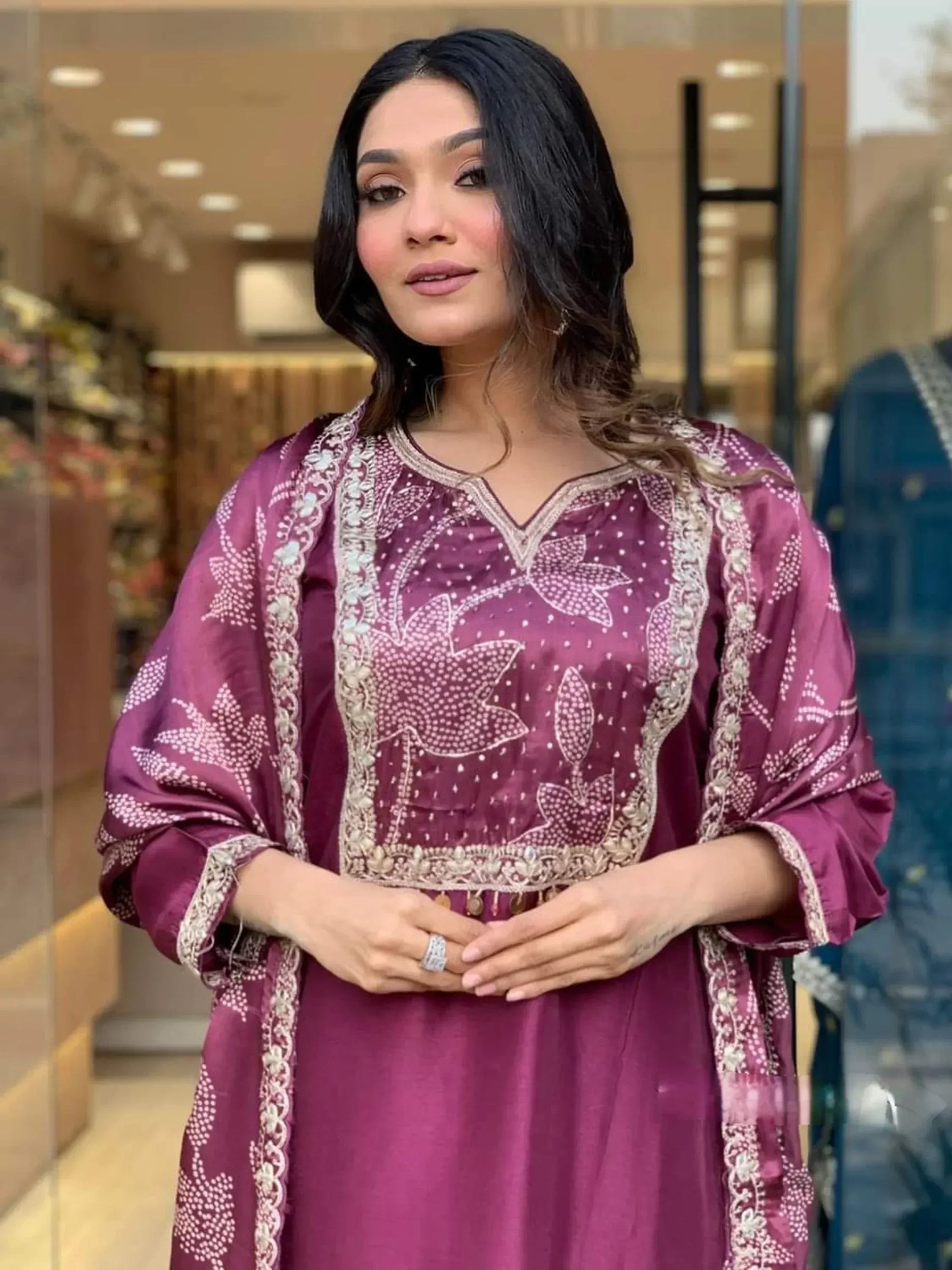 Woman in purple embroidered ethnic kurti with floral patterns, ideal for Indian wear