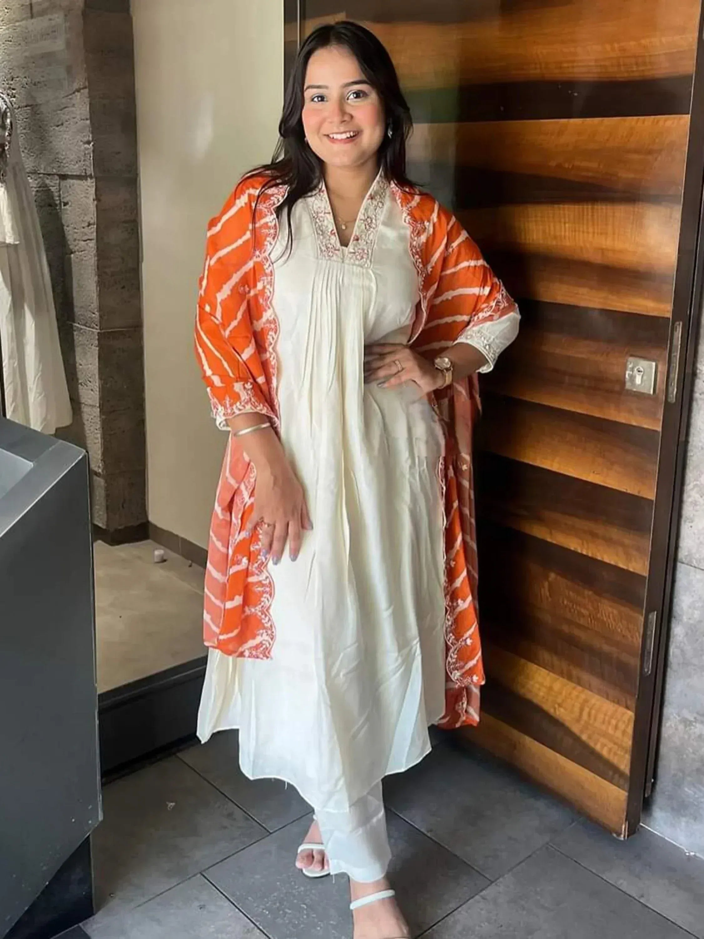 White ethnic kurta with orange printed dupatta, stylish Indian wear for women