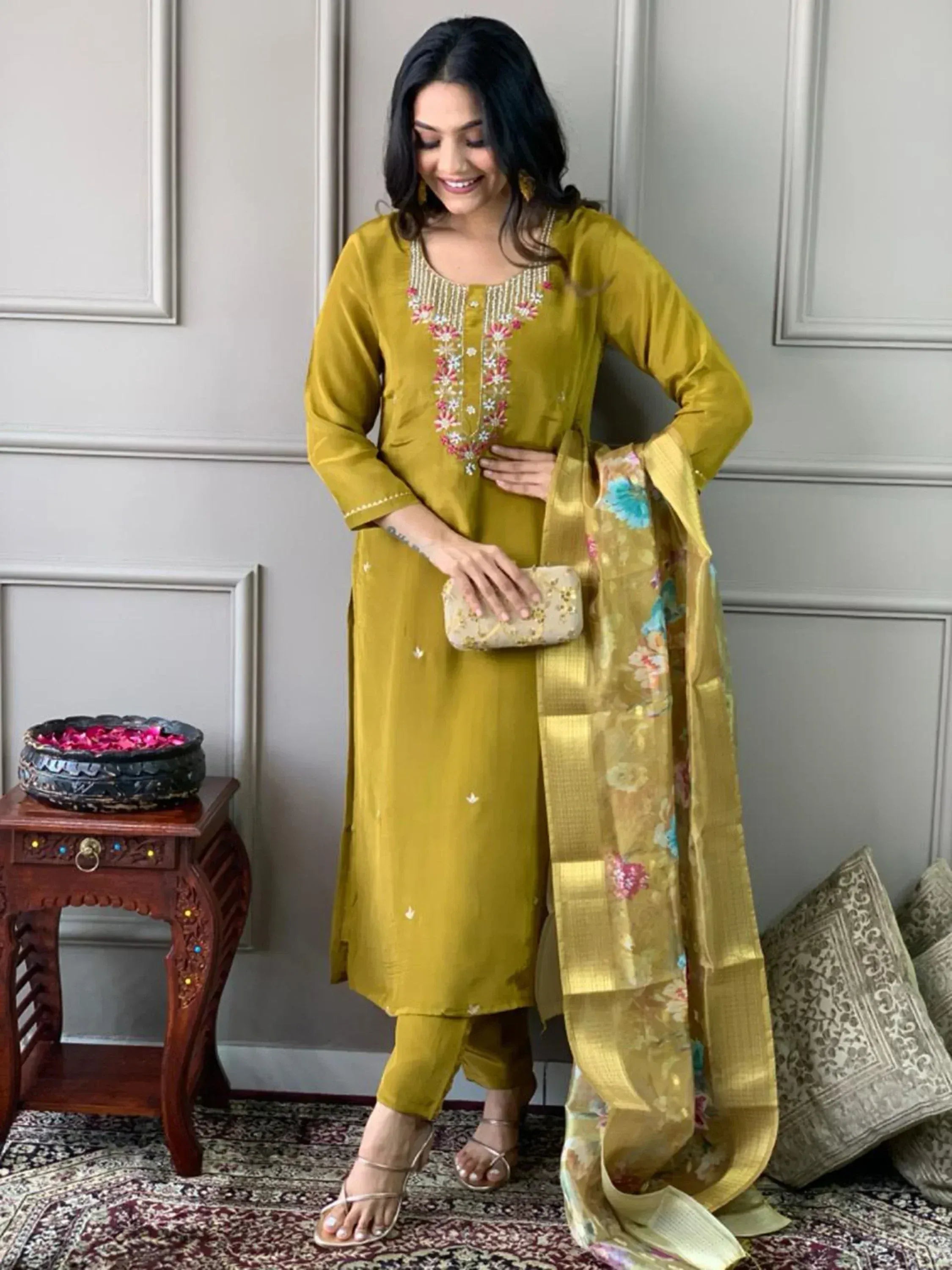 Elegant mustard yellow salwar kameez with floral embroidery and matching dupatta, perfect for ethnic occasions.