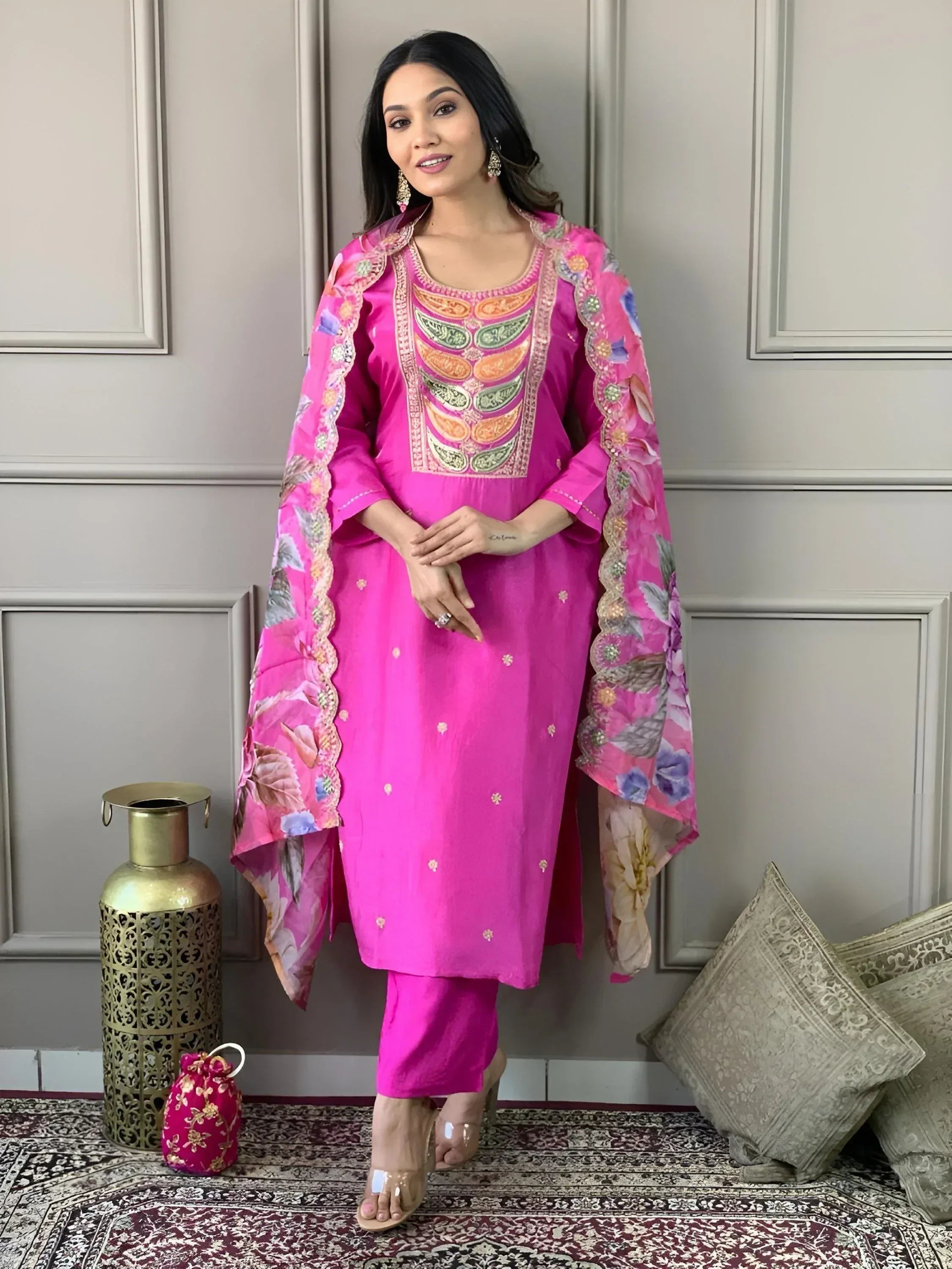 Vibrant pink embroidered salwar kameez with floral dupatta, perfect for Indian ethnic wear occasions.