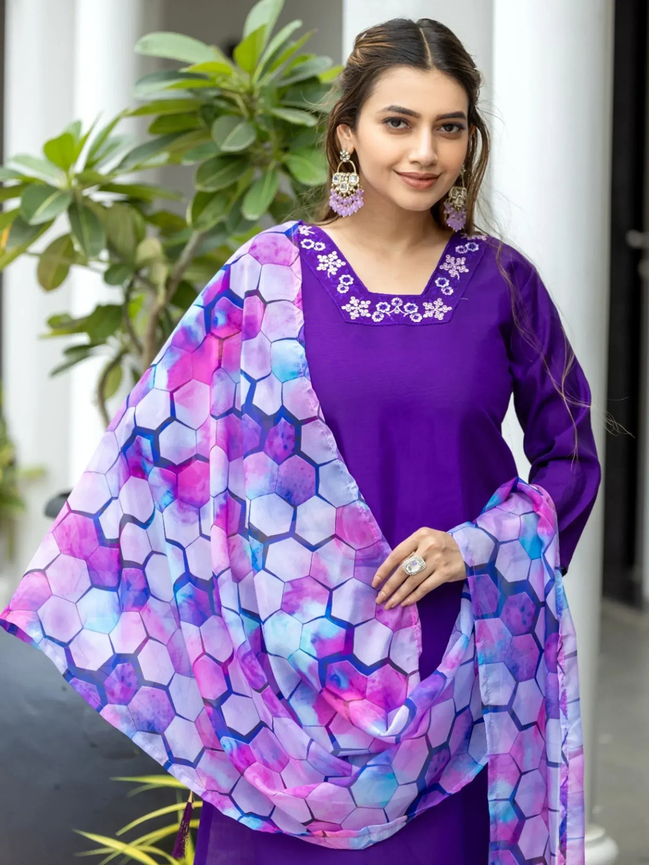 Purple ethnic kurti with floral neckline and hexagon print dupatta, styled with statement earrings