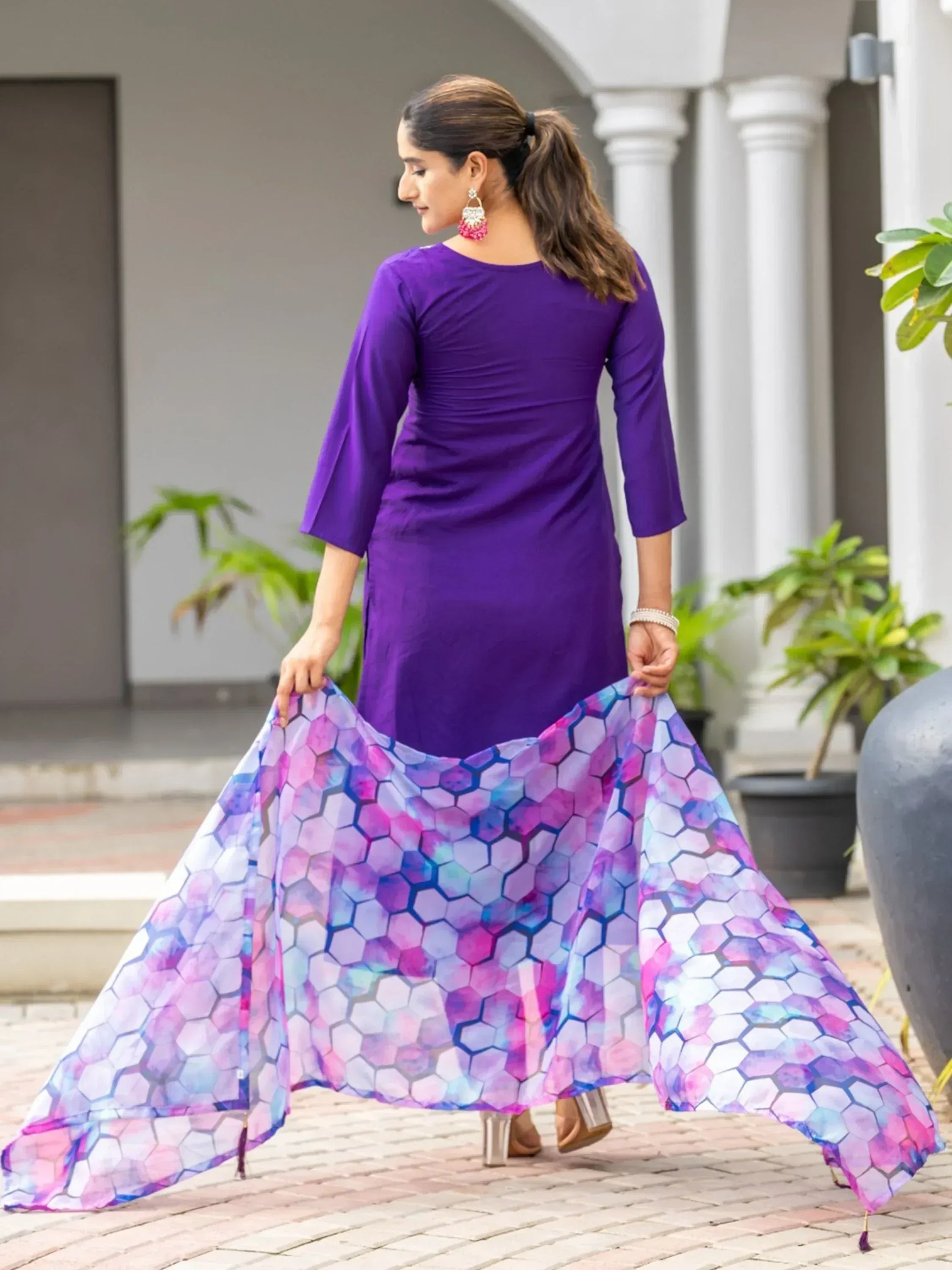 Woman in purple ethnic gown with colorful hexagon dupatta, perfect for Indian occasions