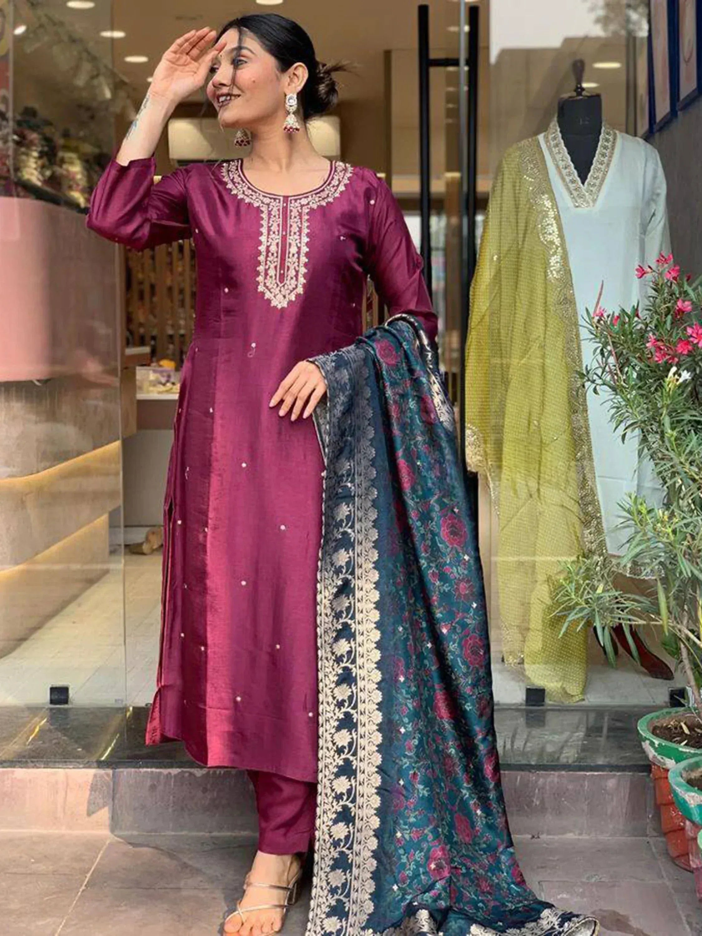 Woman in maroon embroidered salwar kameez with floral dupatta, Indian ethnic wear
