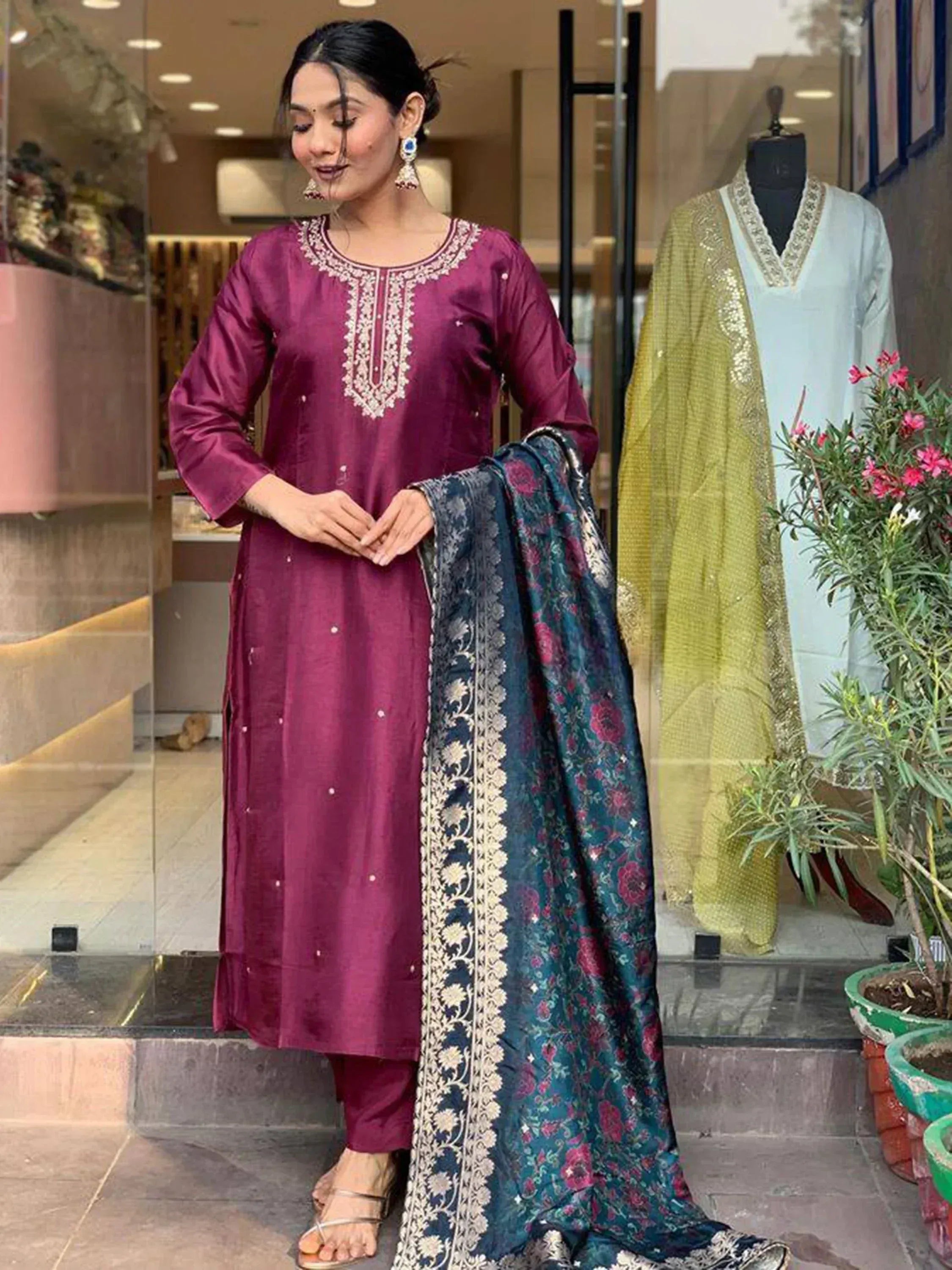Woman in maroon embroidered kurta with floral dupatta, Indian ethnic wear
