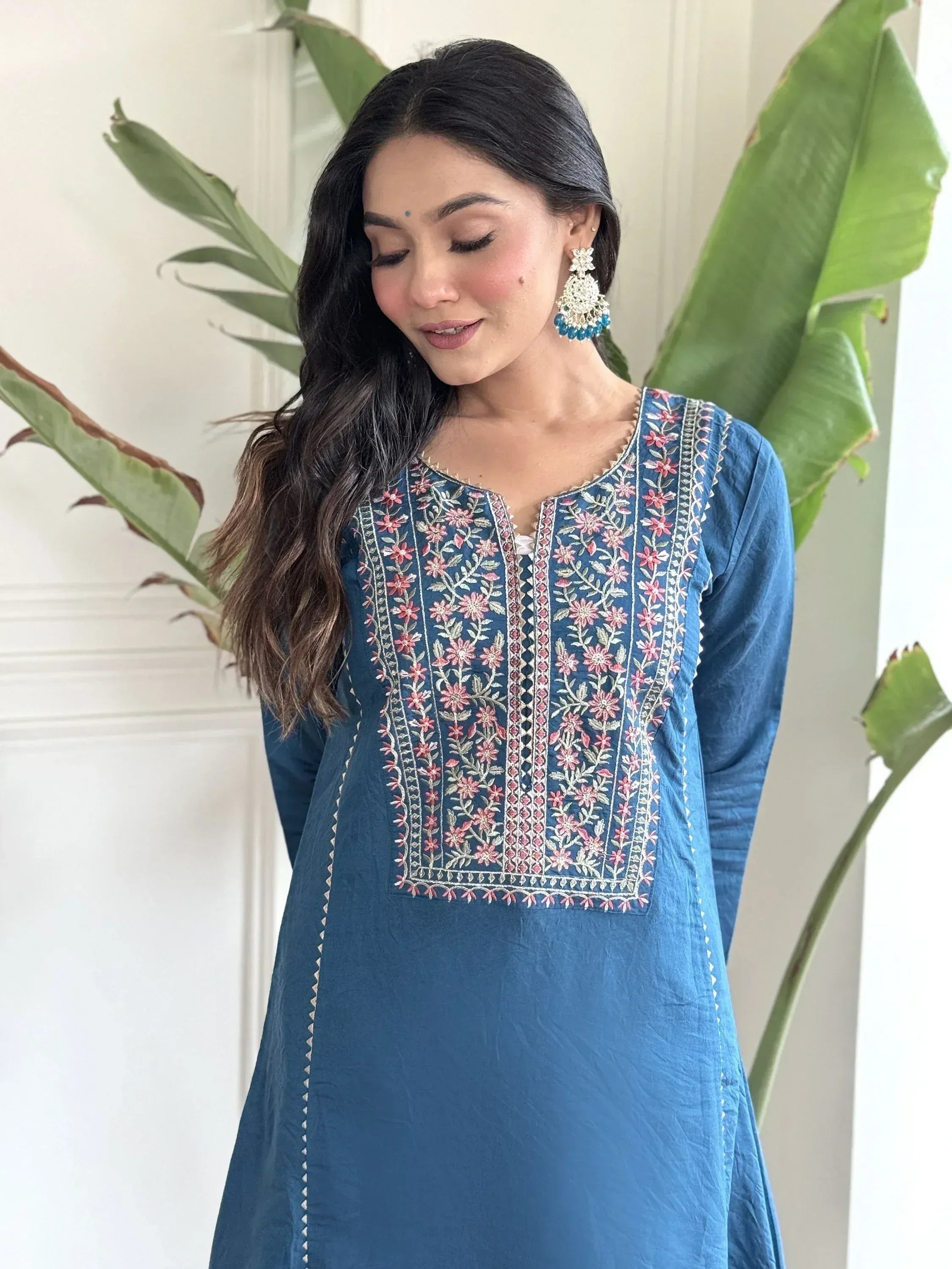 Blue embroidered ethnic kurti with floral detailing, perfect for Indian wear