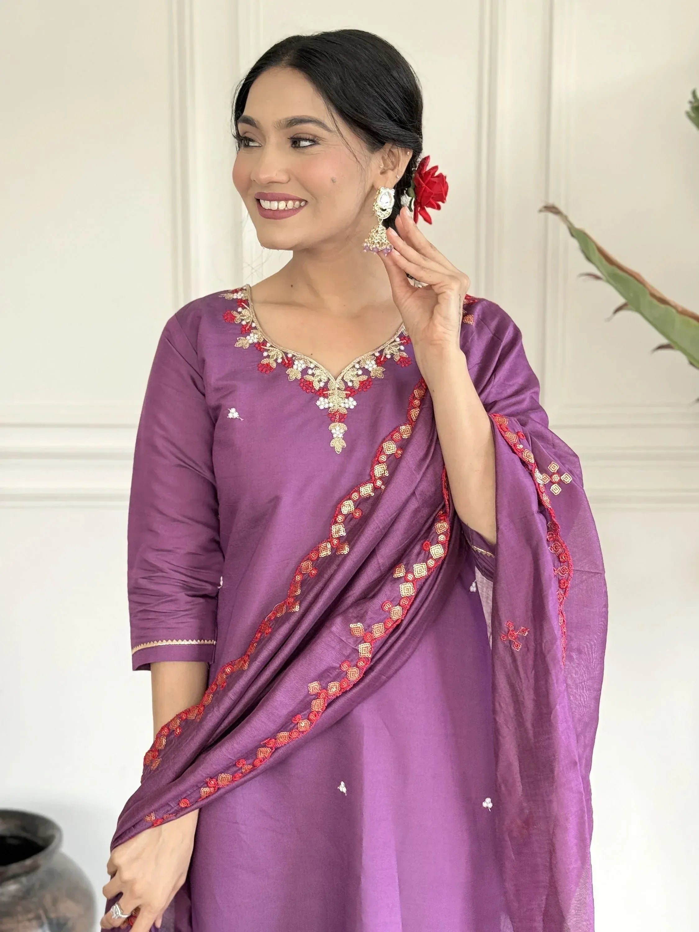 Purple embroidered salwar kameez with red gold detailing, perfect for Indian ethnic wear occasions