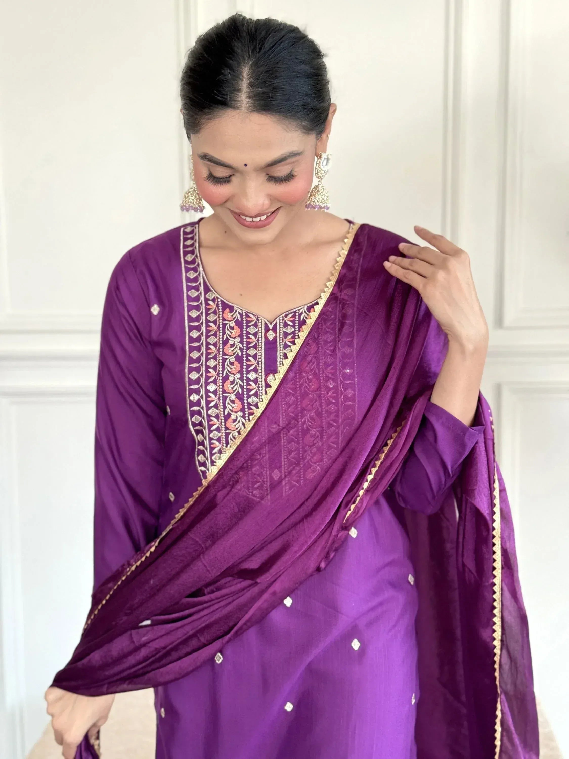 Purple embroidered salwar kameez with gold detailing, perfect for Indian ethnic wear occasions