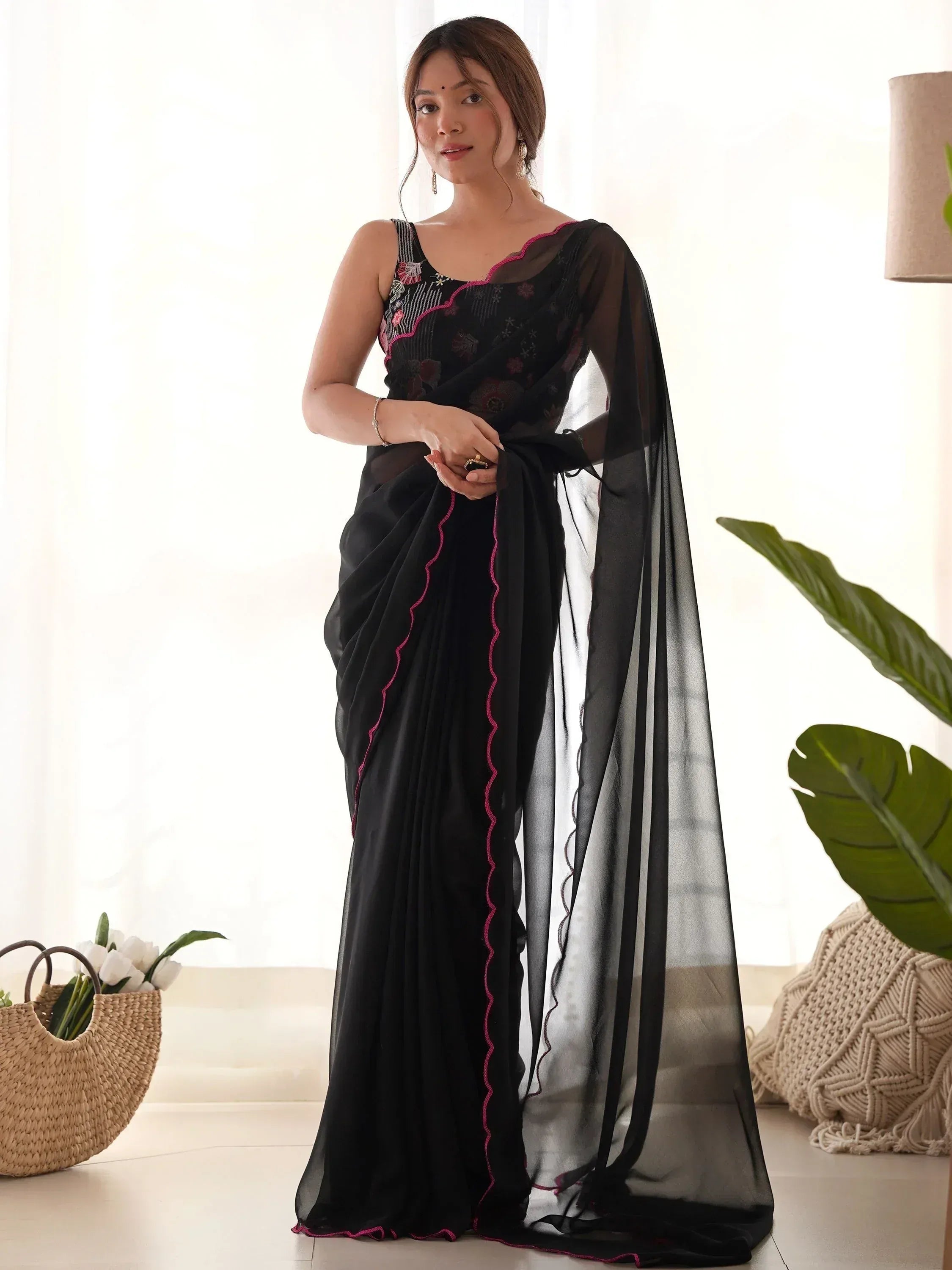 Black sheer saree with pink embroidery, elegant ethnic wear for women