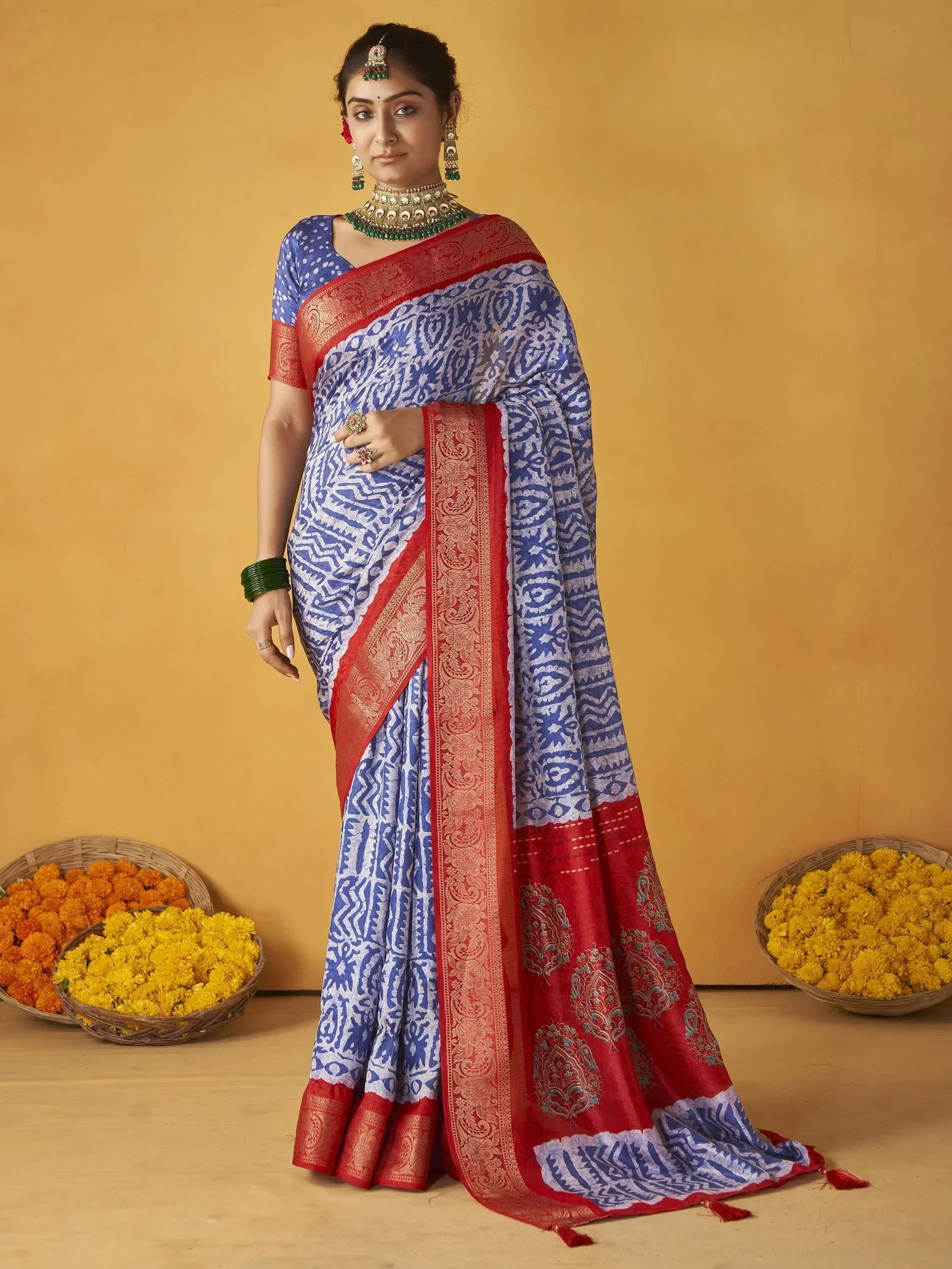 Blue and red printed saree with gold border, traditional Indian ethnic wear, styled with temple jewelry