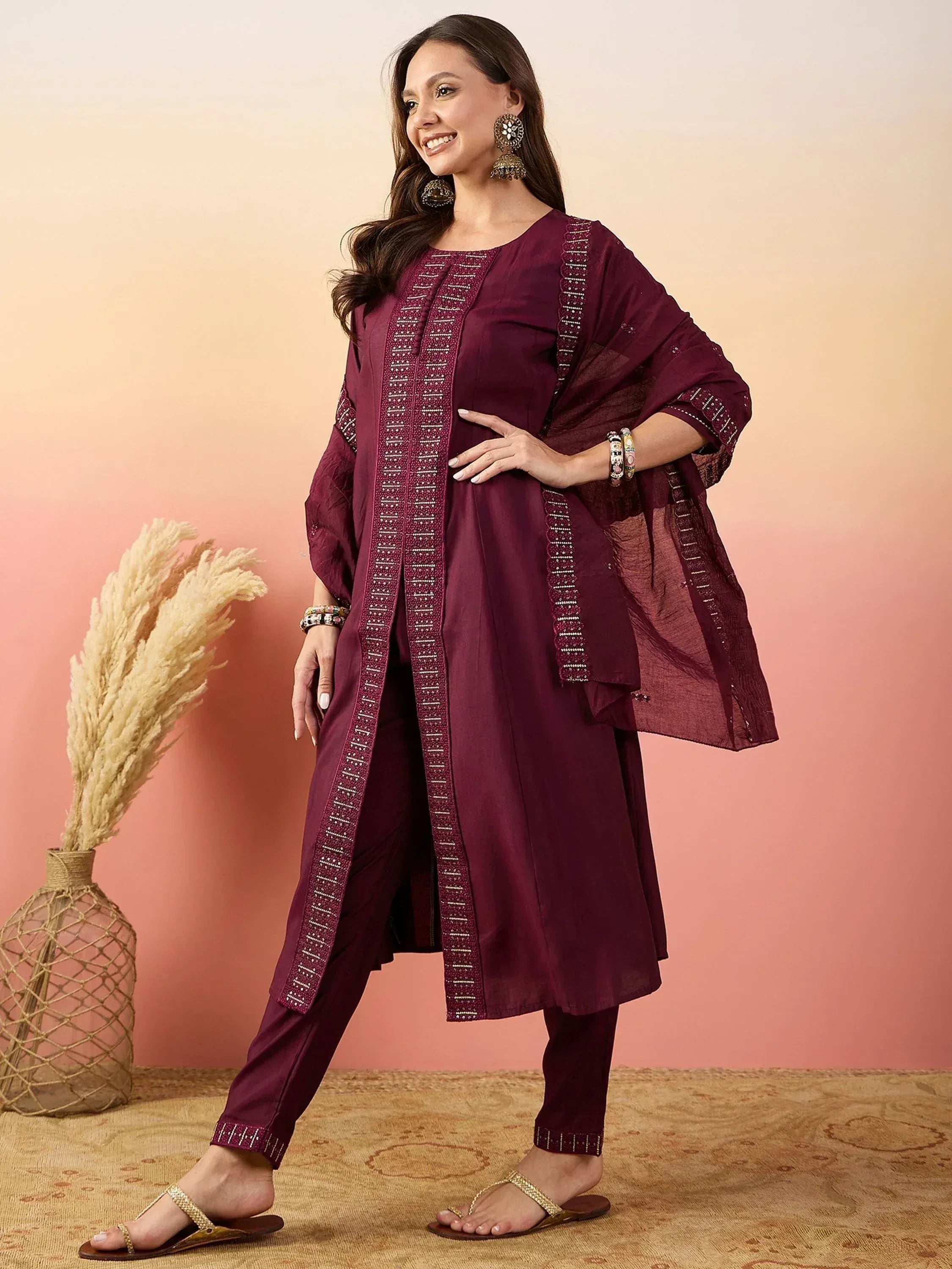 Elegant maroon ethnic salwar kameez with embroidered detailing, perfect for festive occasions.