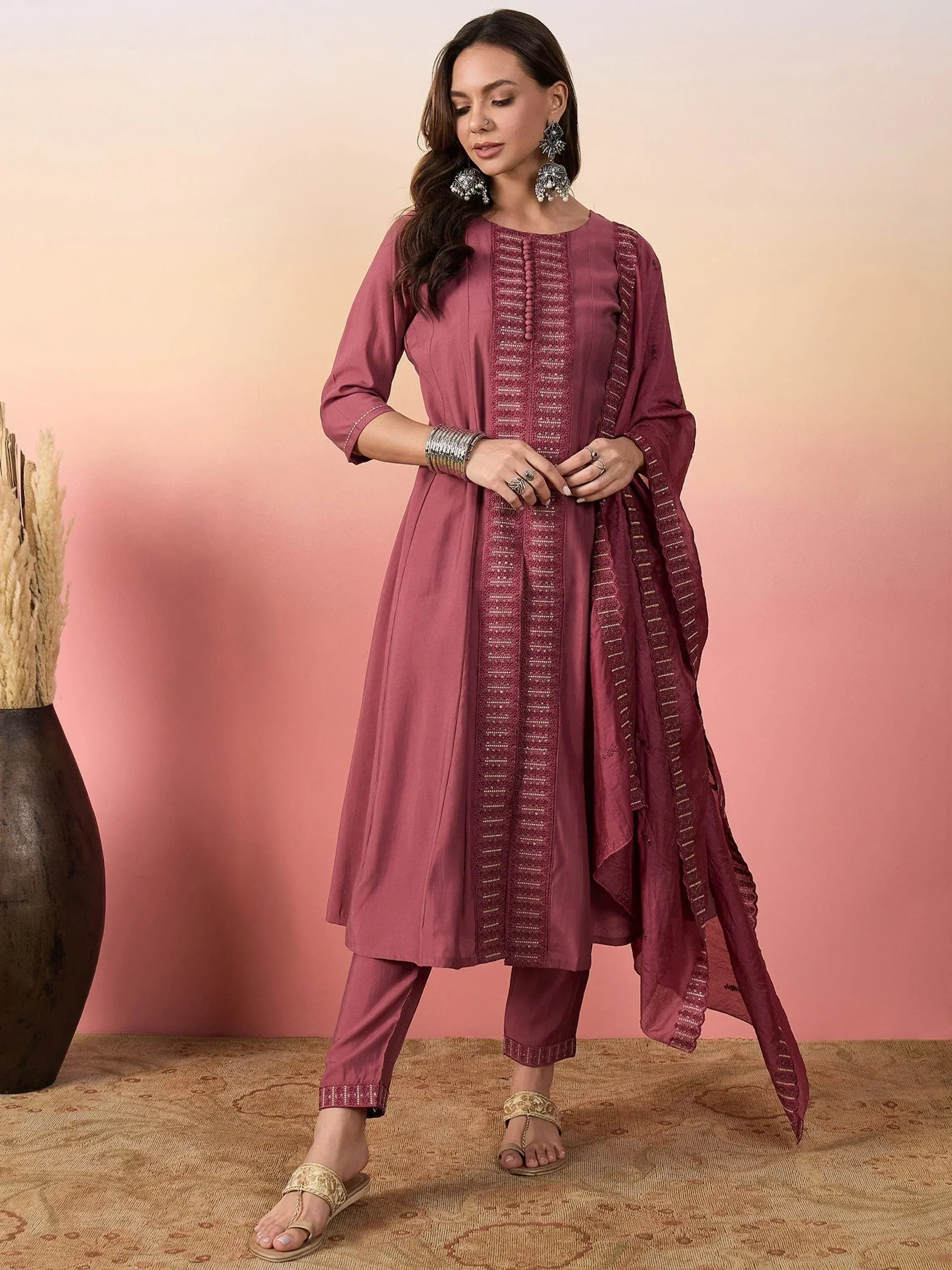 Elegant maroon salwar kameez with embroidered detailing, perfect for ethnic occasions
