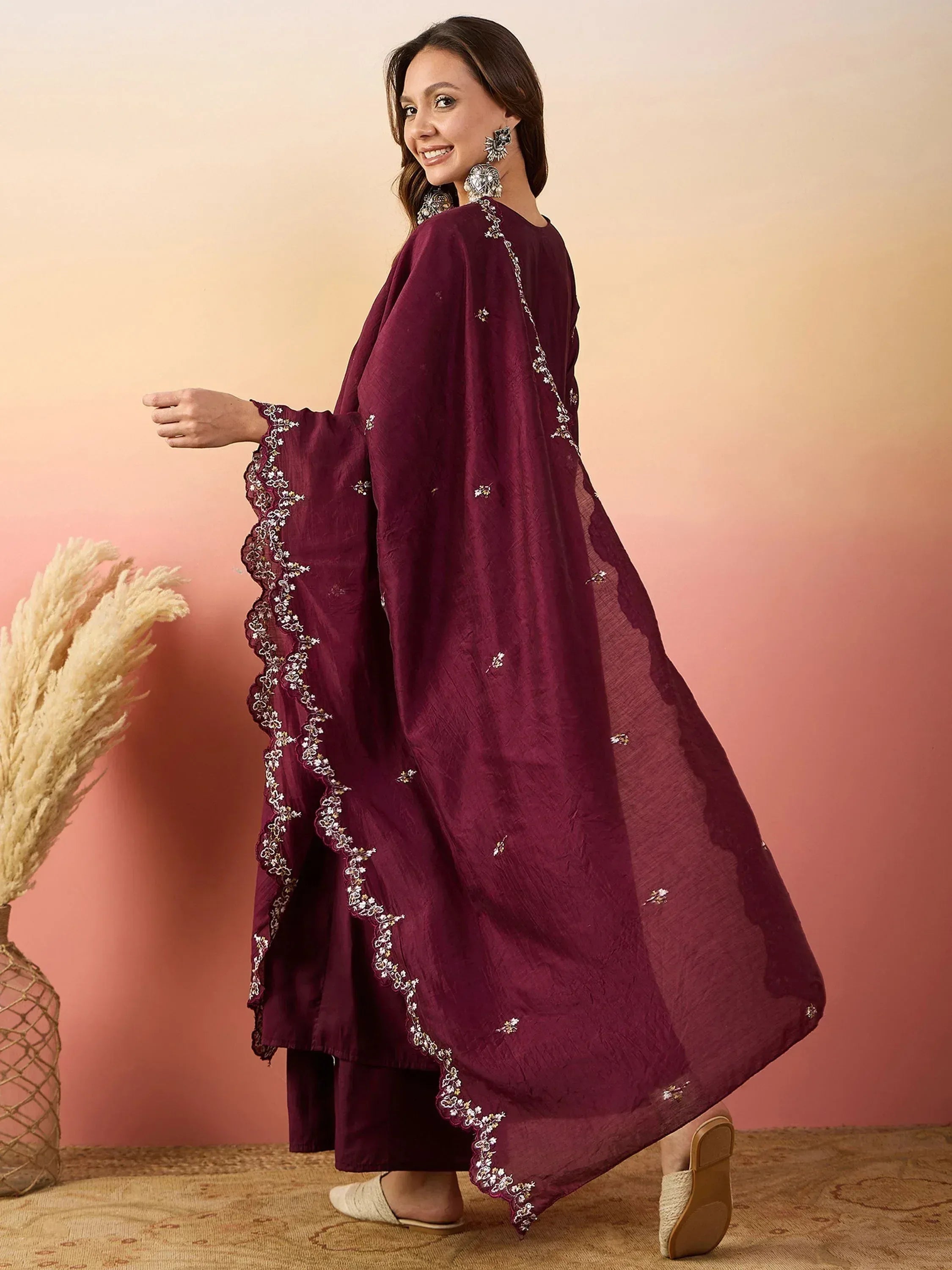 Maroon embroidered ethnic gown with scalloped sleeves, perfect for Indian festive wear