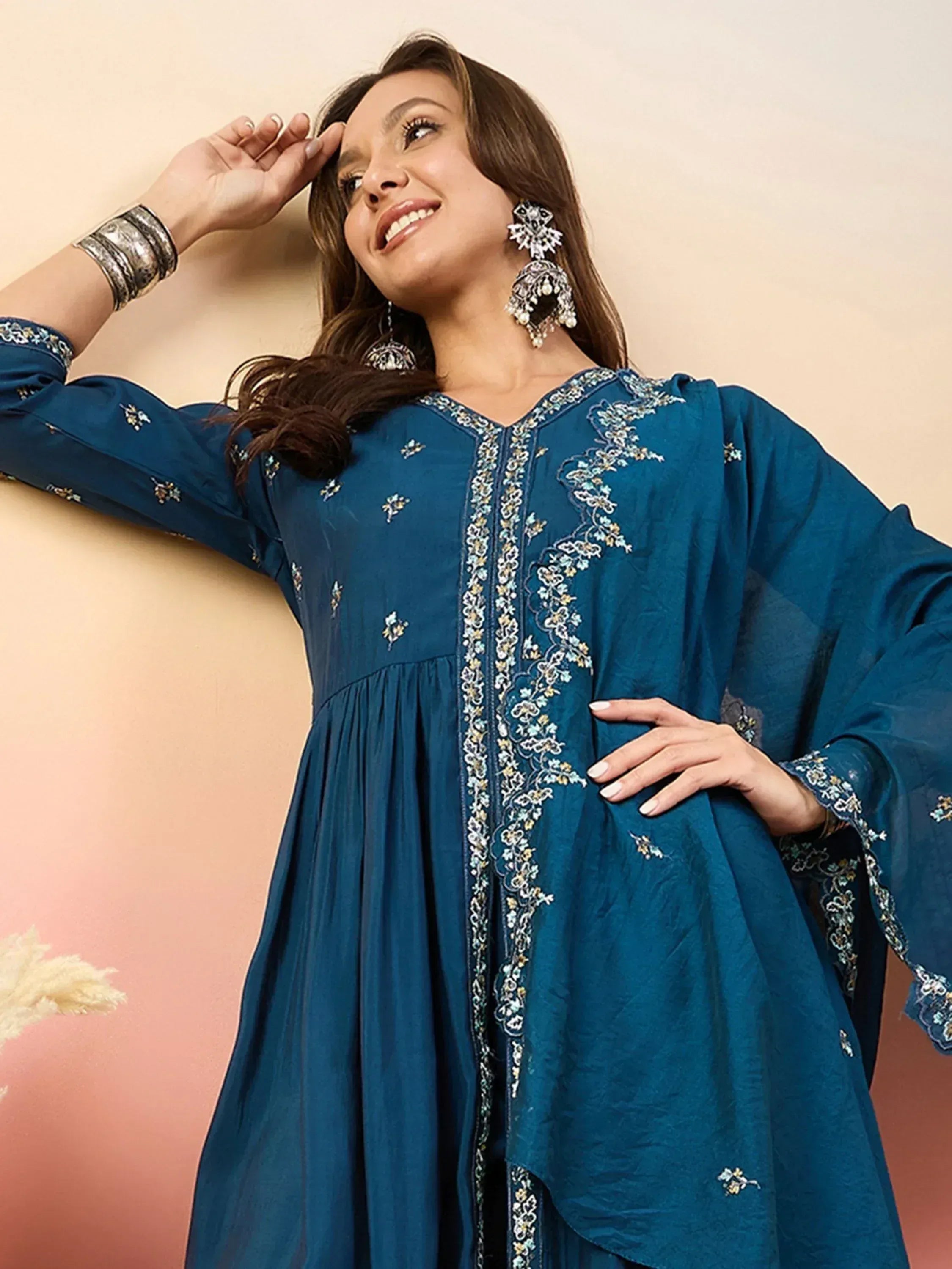 Blue embroidered ethnic gown with floral detailing, perfect for Indian wear and festive occasions