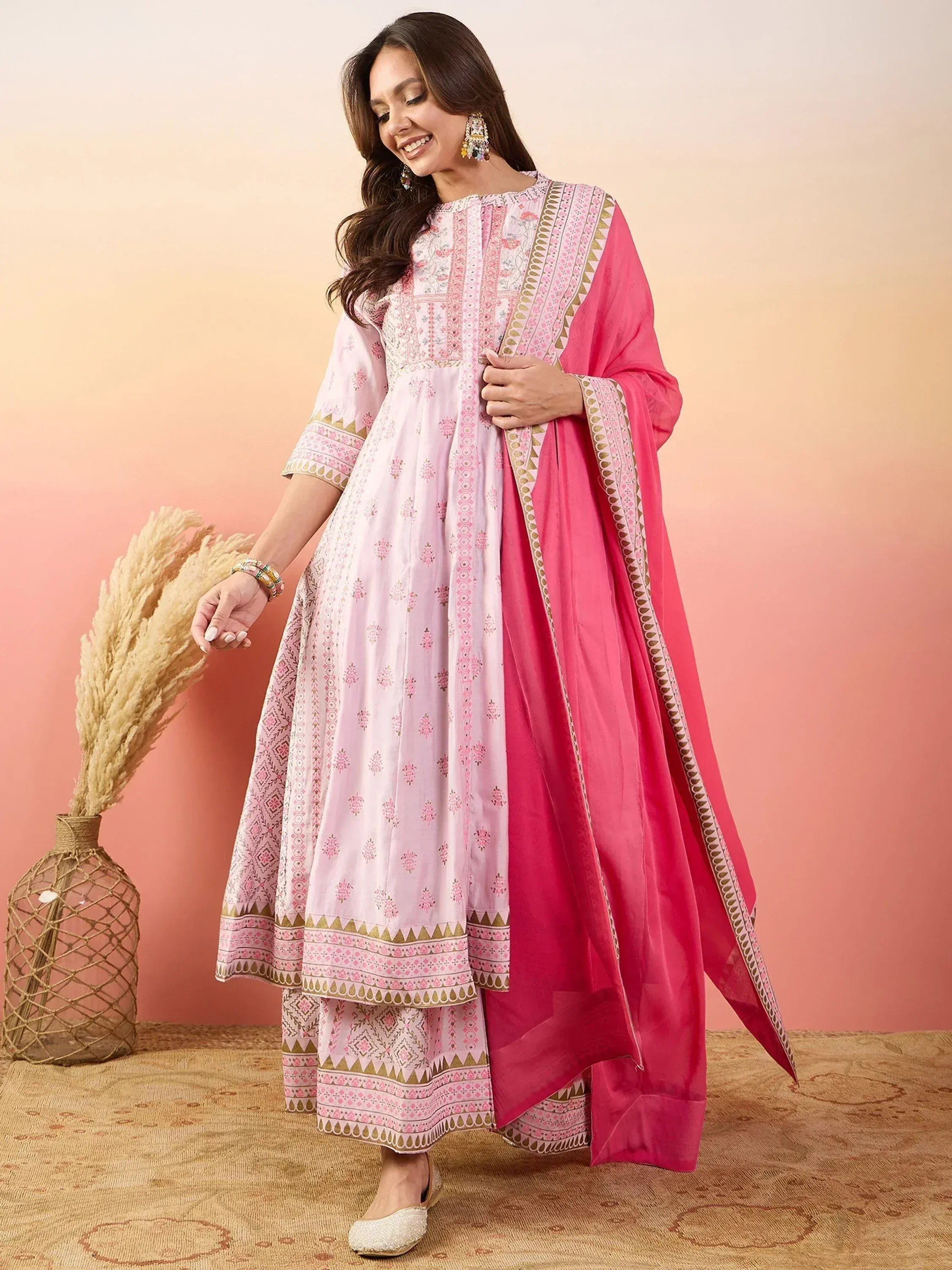 Pink printed ethnic salwar kameez with matching dupatta, perfect for Indian festive wear