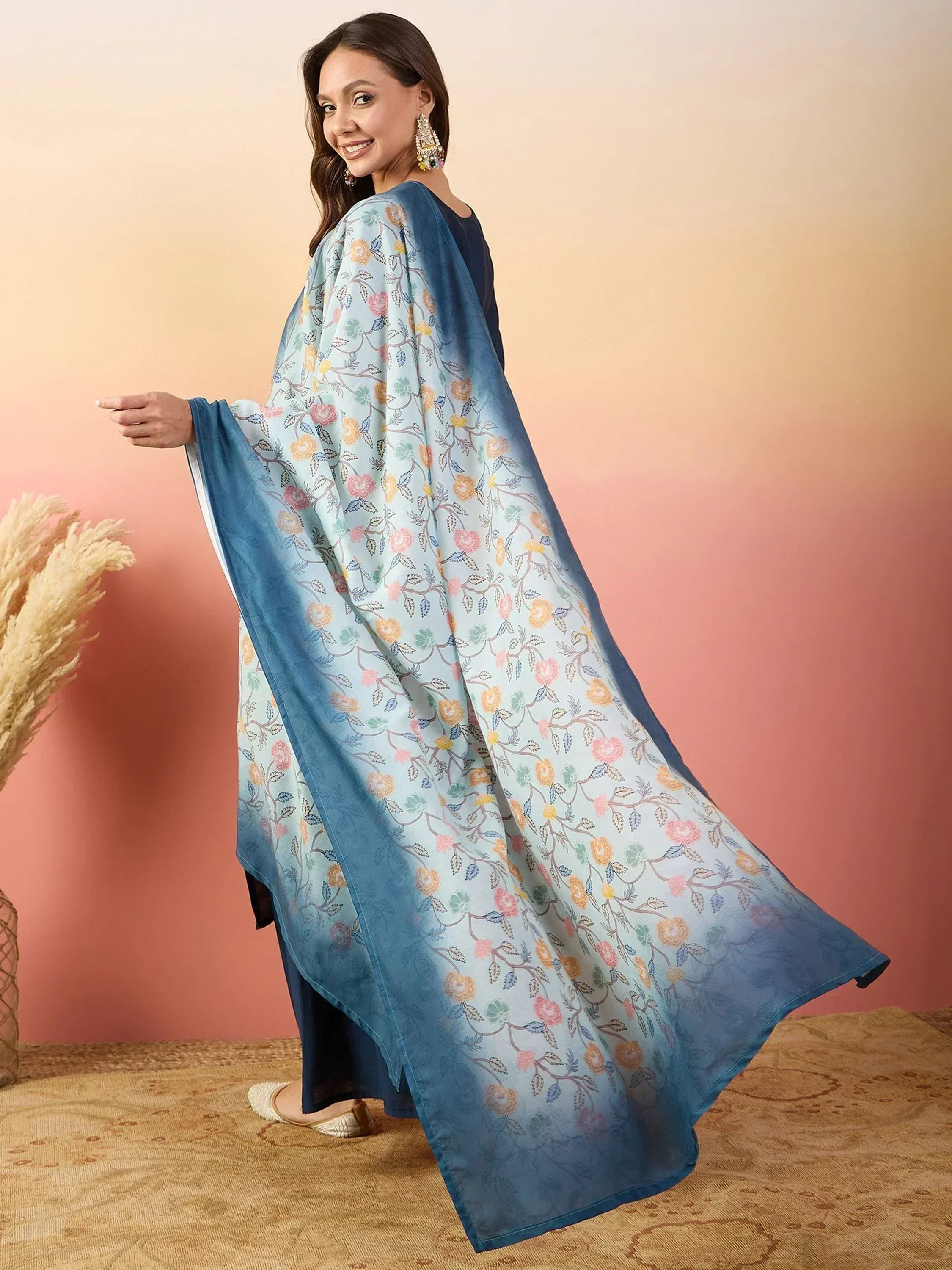 Floral print ethnic cape with blue ombre border, styled with salwar kameez for festive occasions