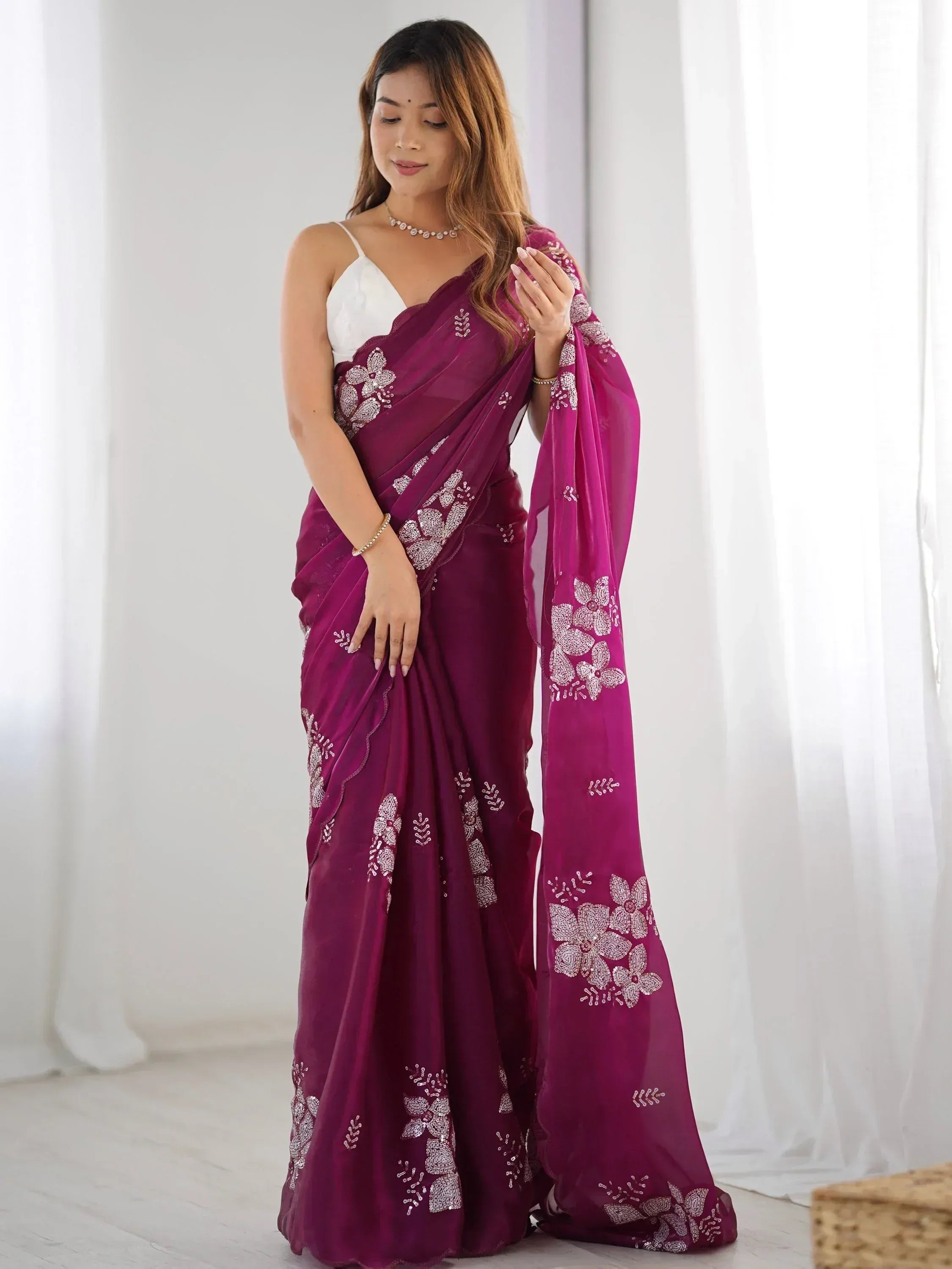Elegant purple saree with floral embroidery, perfect for Indian ethnic wear occasions.