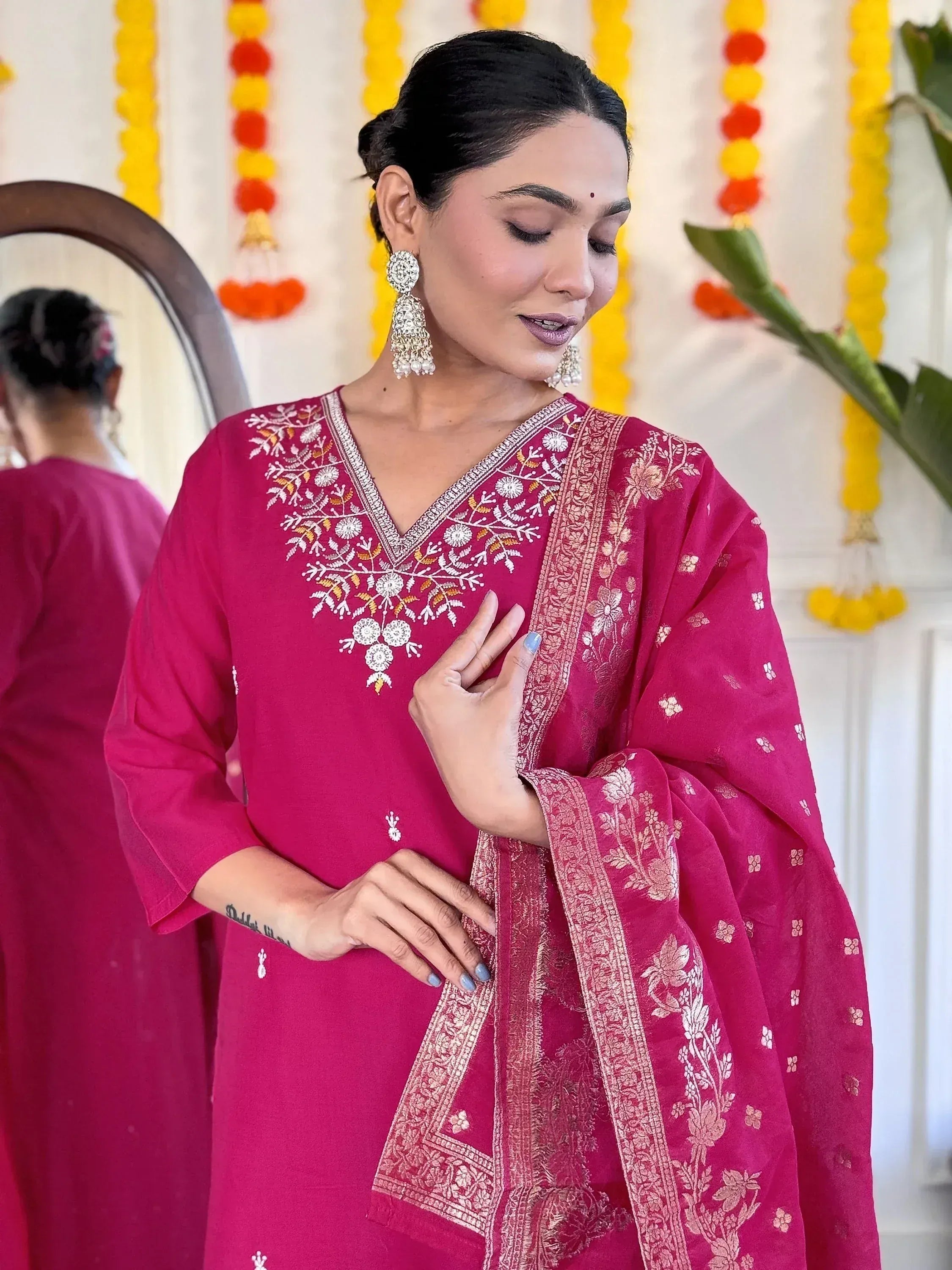 Pink embroidered salwar kameez with floral detailing, perfect for Indian ethnic wear occasions