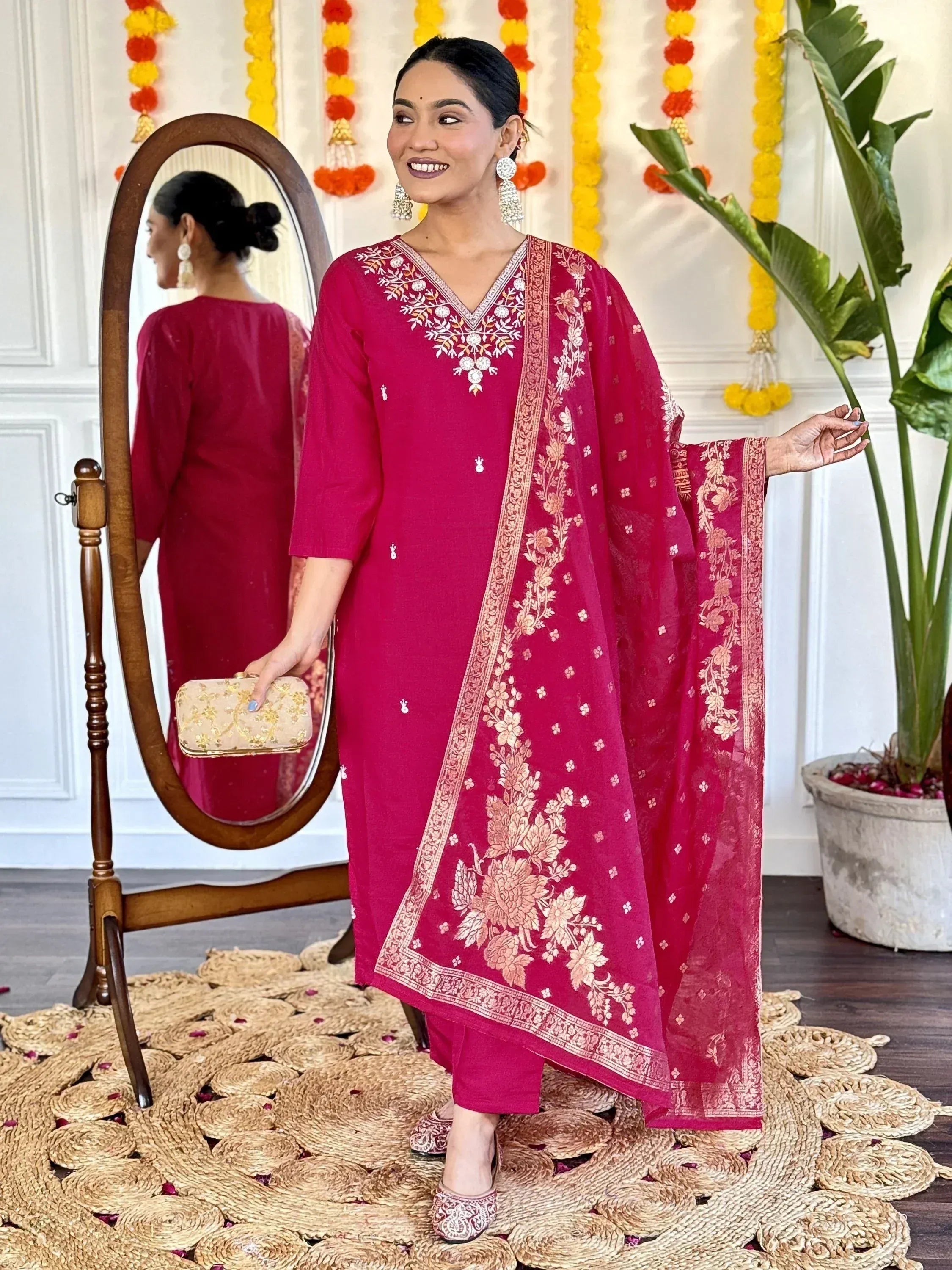 Elegant maroon salwar kameez with floral embroidery and matching dupatta, perfect for festive occasions.