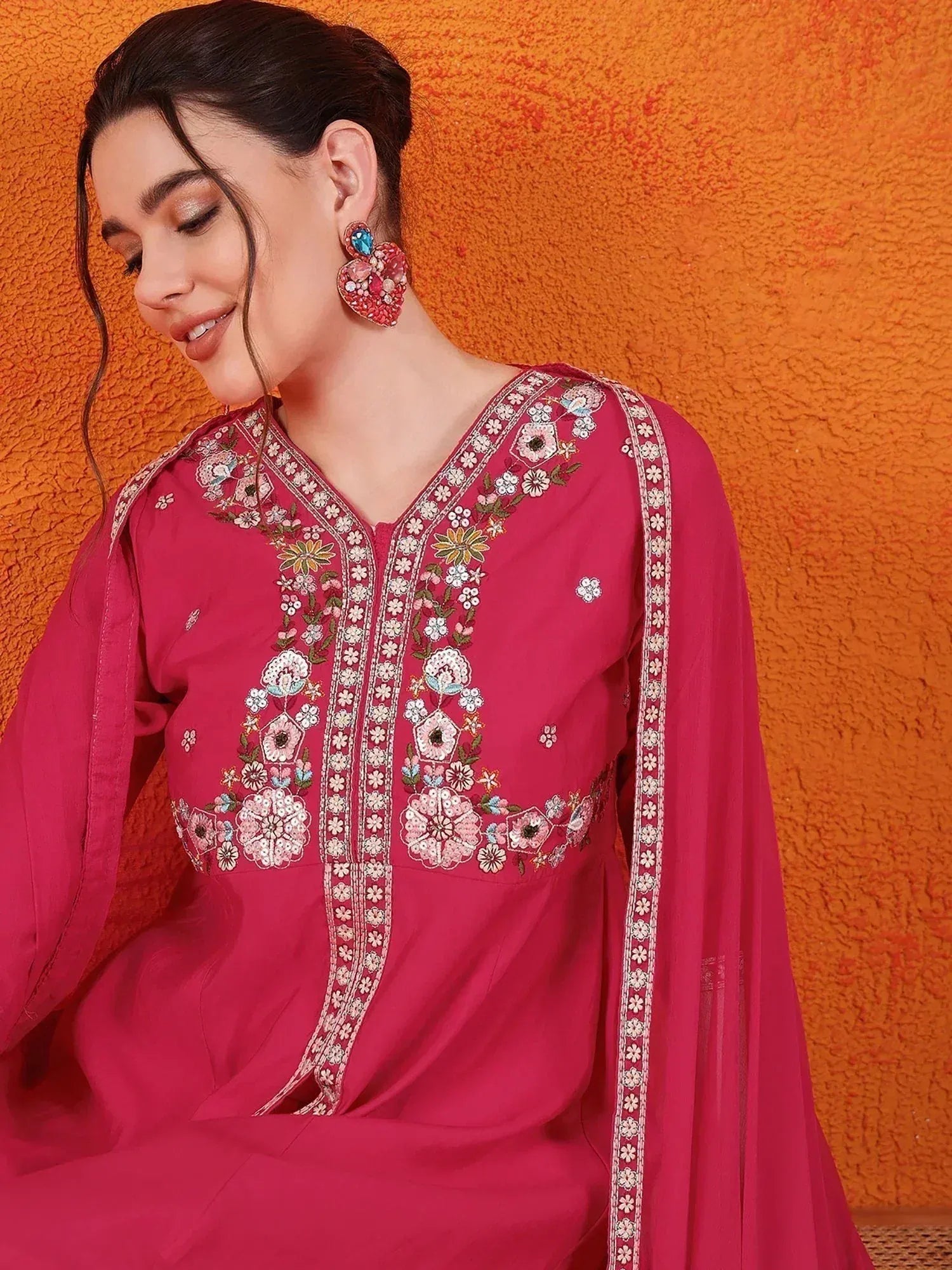Pink embroidered ethnic kurti with floral detailing, perfect for Indian wear