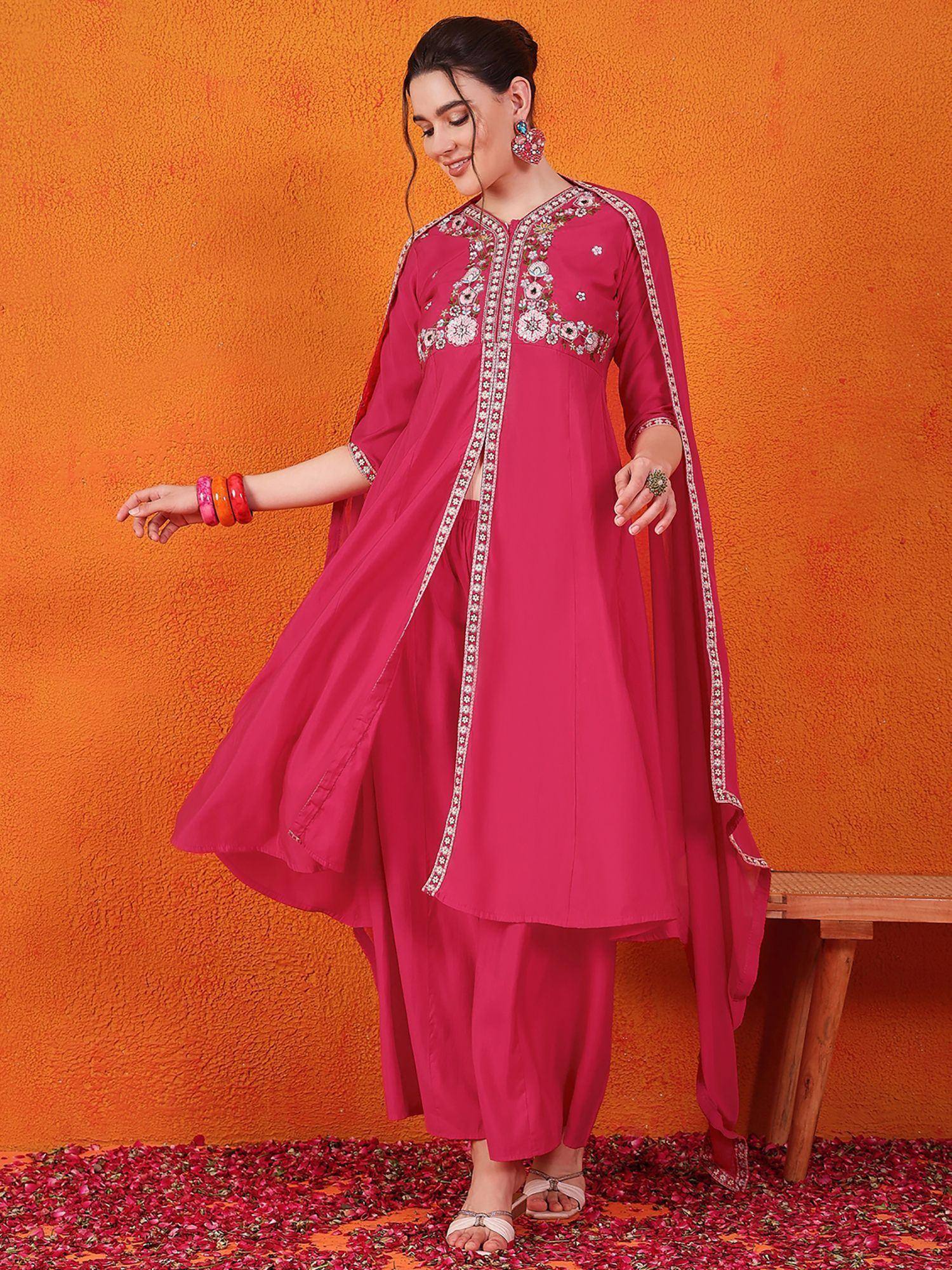 Pink embroidered ethnic salwar kameez with floral detailing, perfect for festive occasions