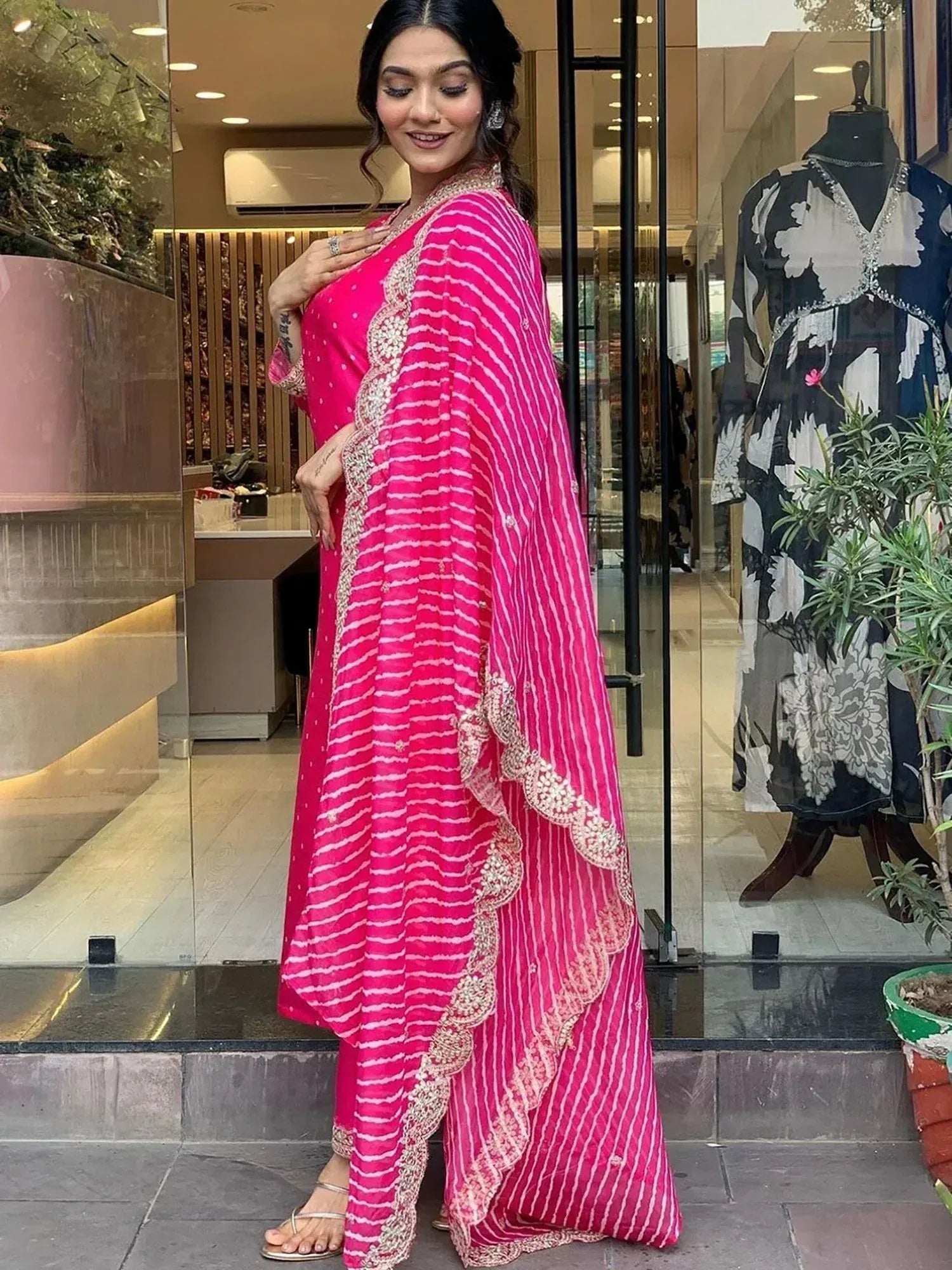 Pink striped ethnic salwar kameez with lace detailing, perfect for festive occasions