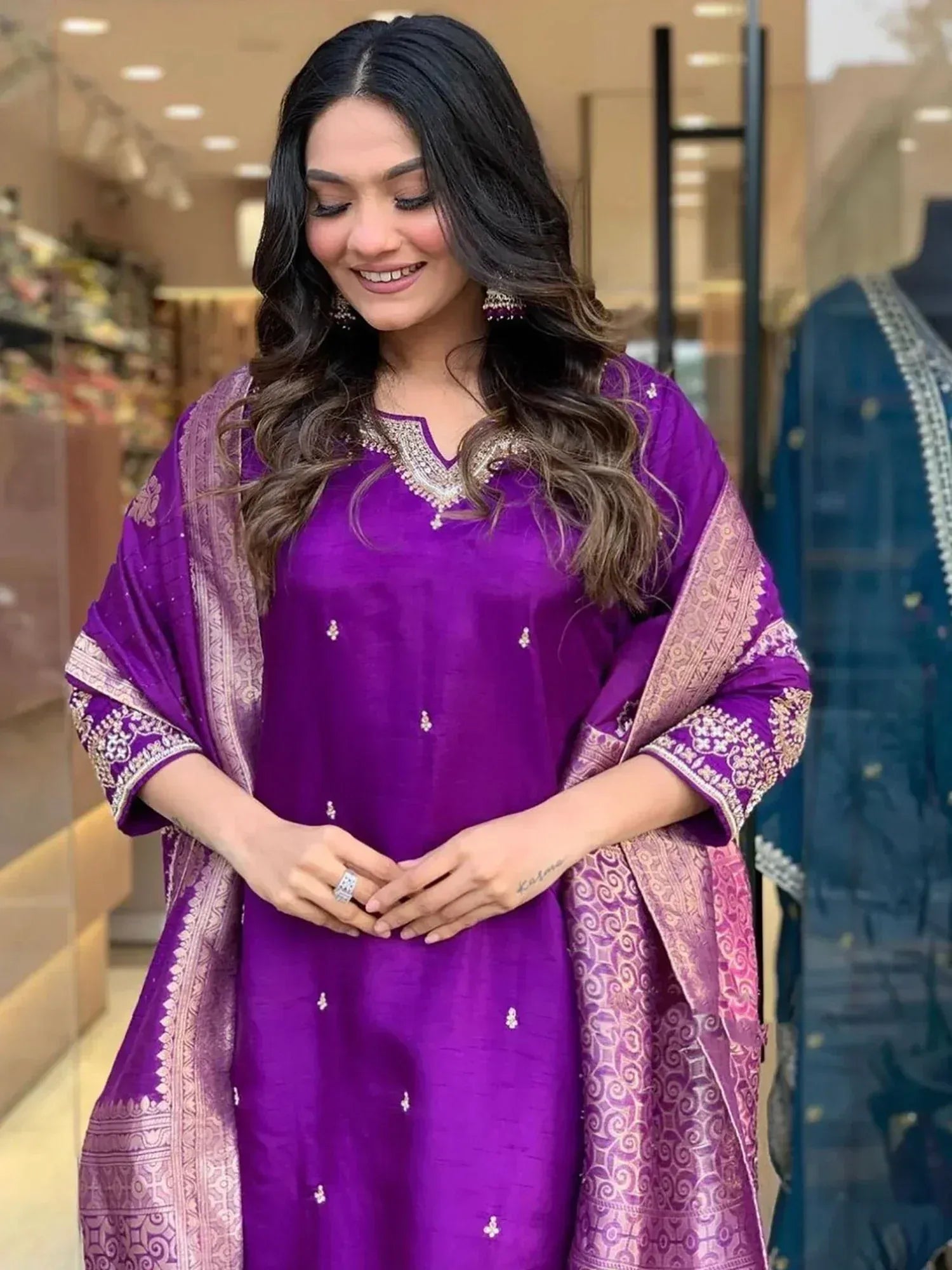 Purple ethnic salwar kameez with gold embroidery and dupatta, perfect for Indian festive occasions