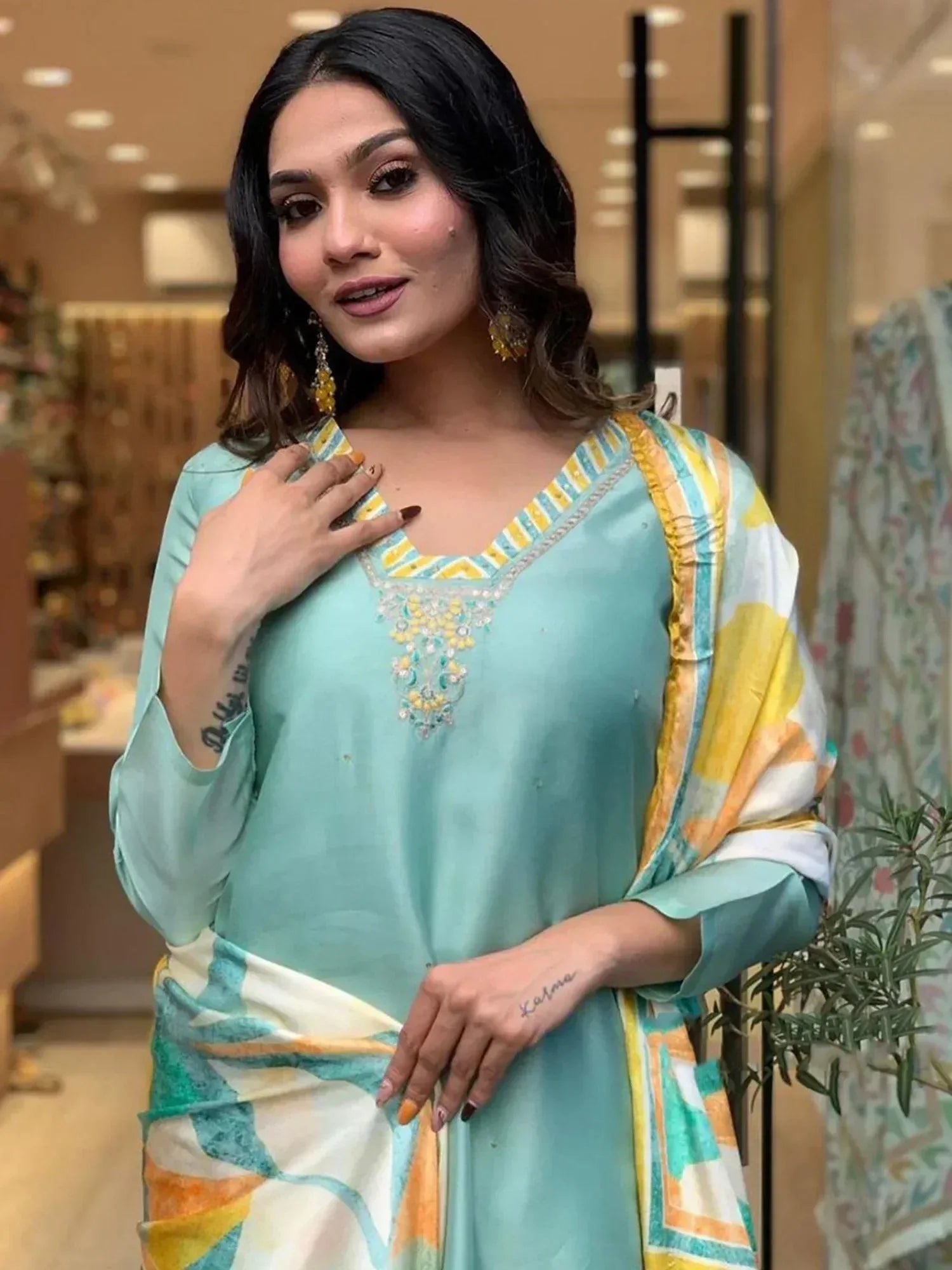 Woman in mint green embroidered kurta with colorful dupatta, Indian ethnic wear