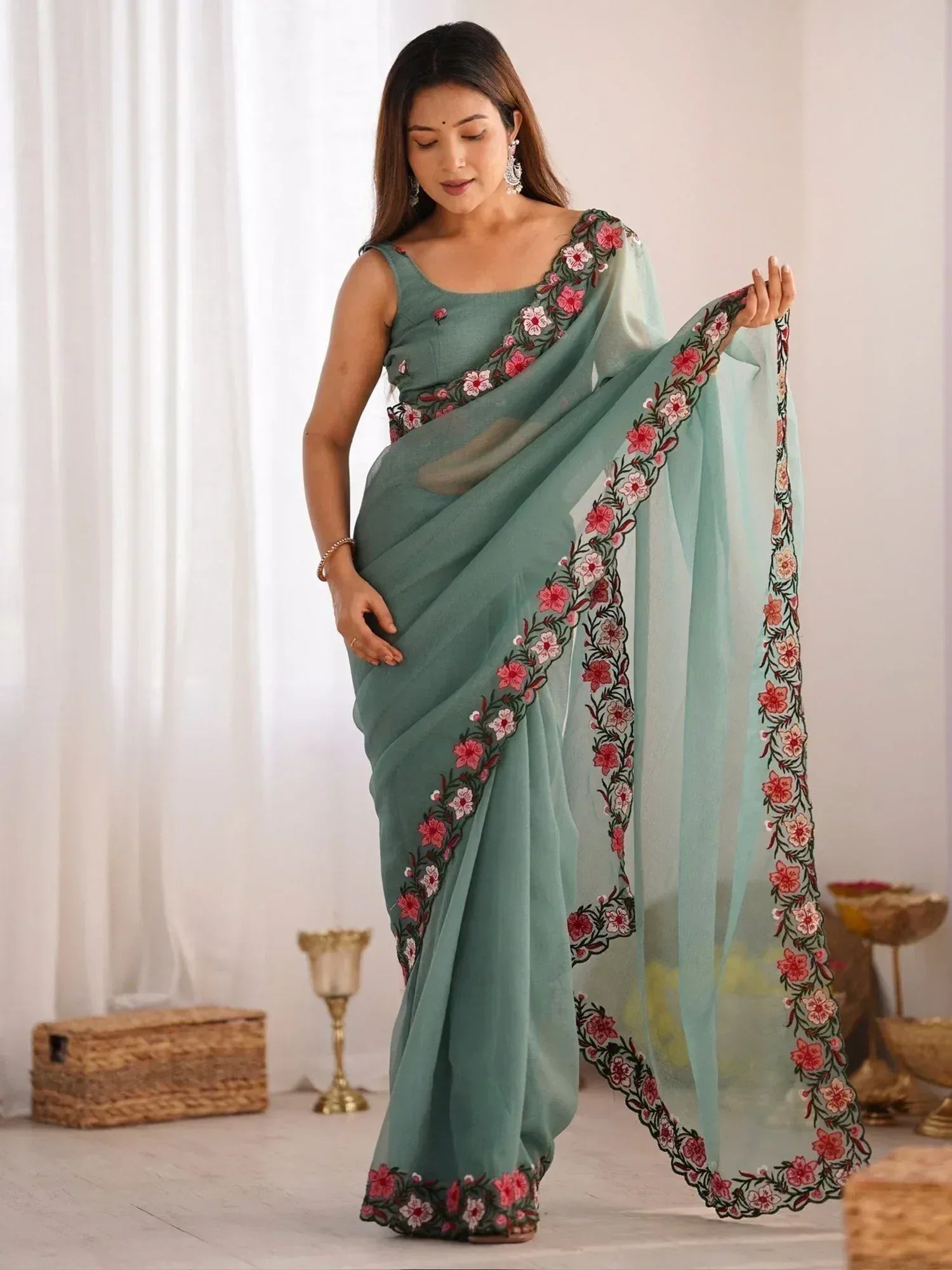 Mint green saree with pink floral embroidery, perfect for Indian ethnic wear occasions
