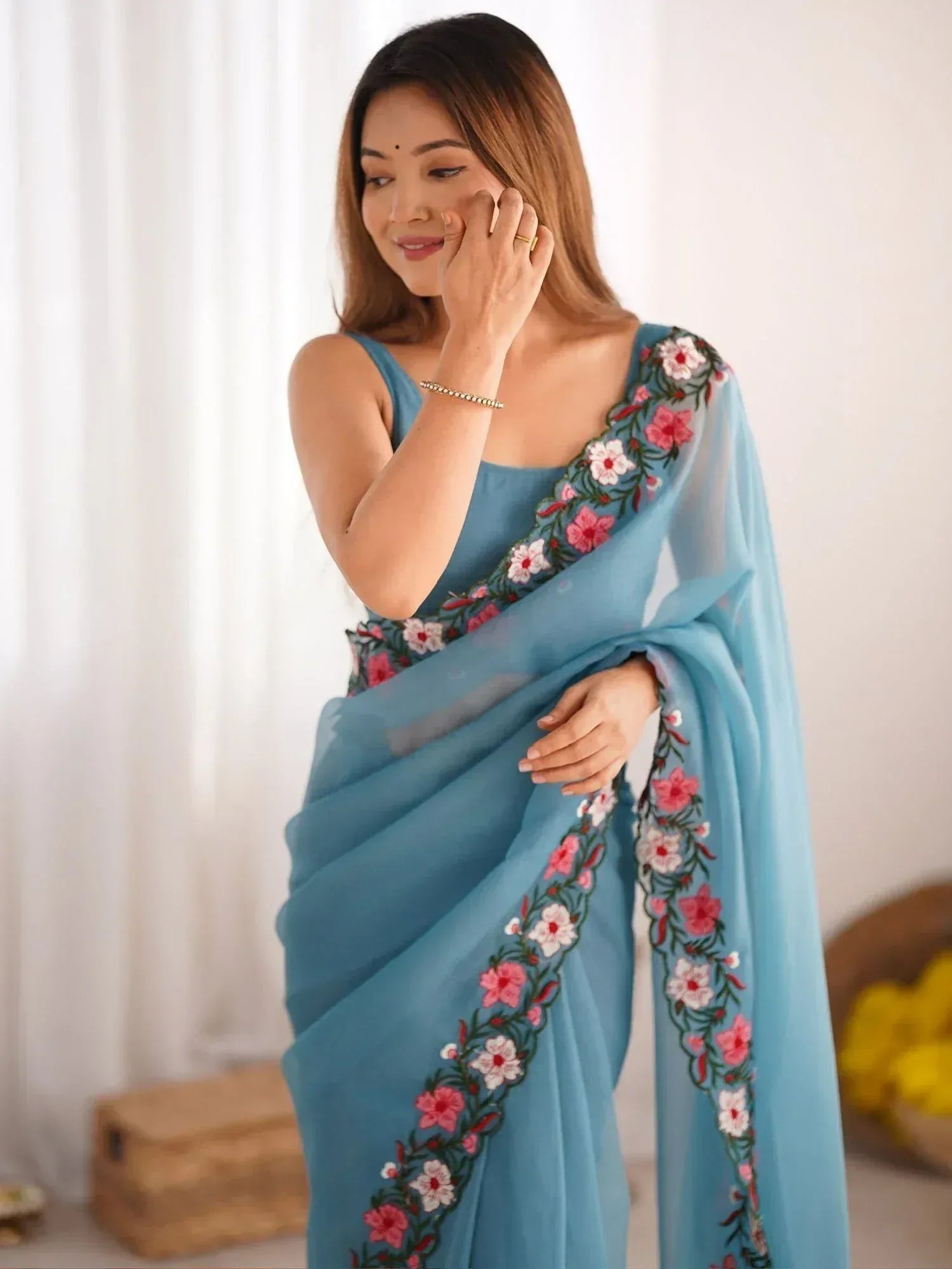 Blue saree with pink and white floral embroidery, elegant Indian ethnic wear for women
