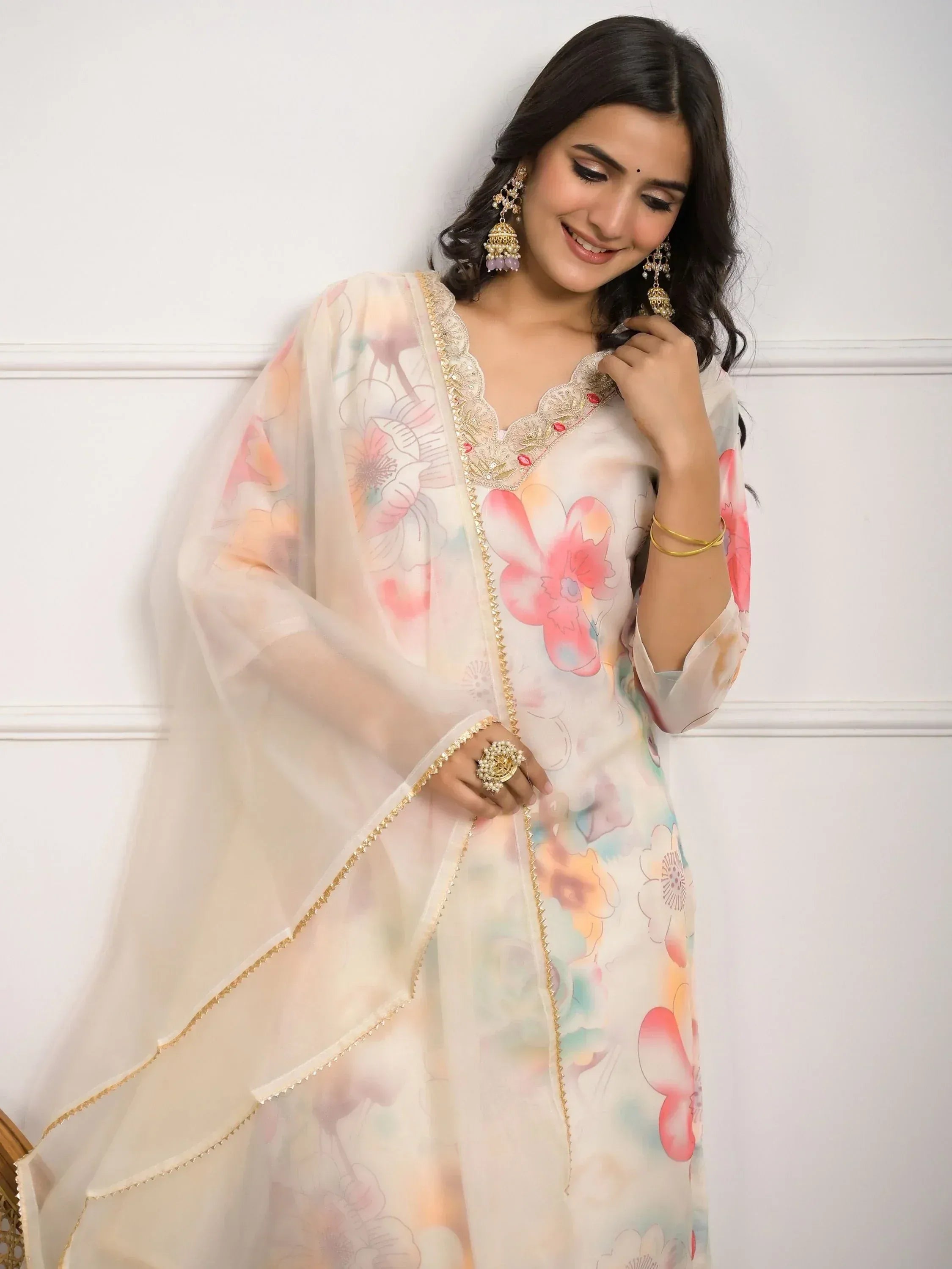 Floral print Indian ethnic kurta with gold embroidery and sheer dupatta, styled with jhumka earrings
