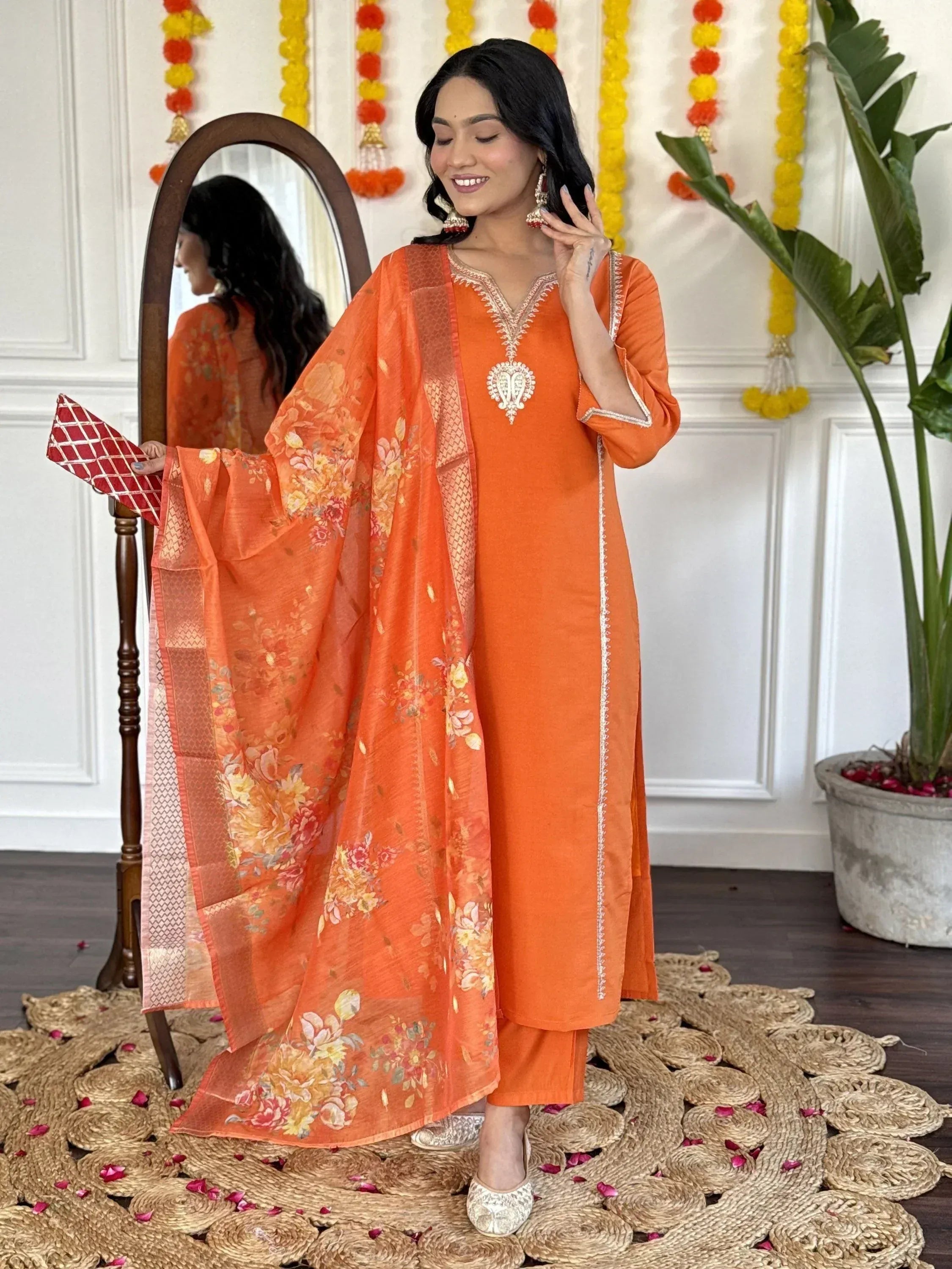 Orange embroidered salwar kameez with floral dupatta, perfect for Indian ethnic wear occasions