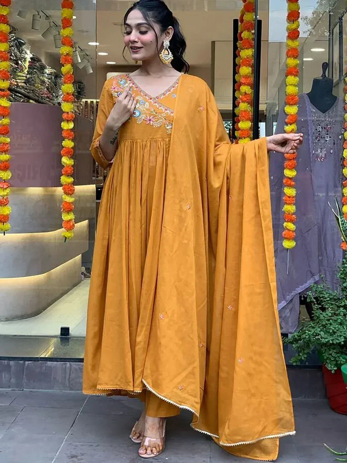 Mustard yellow embroidered ethnic gown with cape sleeve, perfect for Indian festive occasions