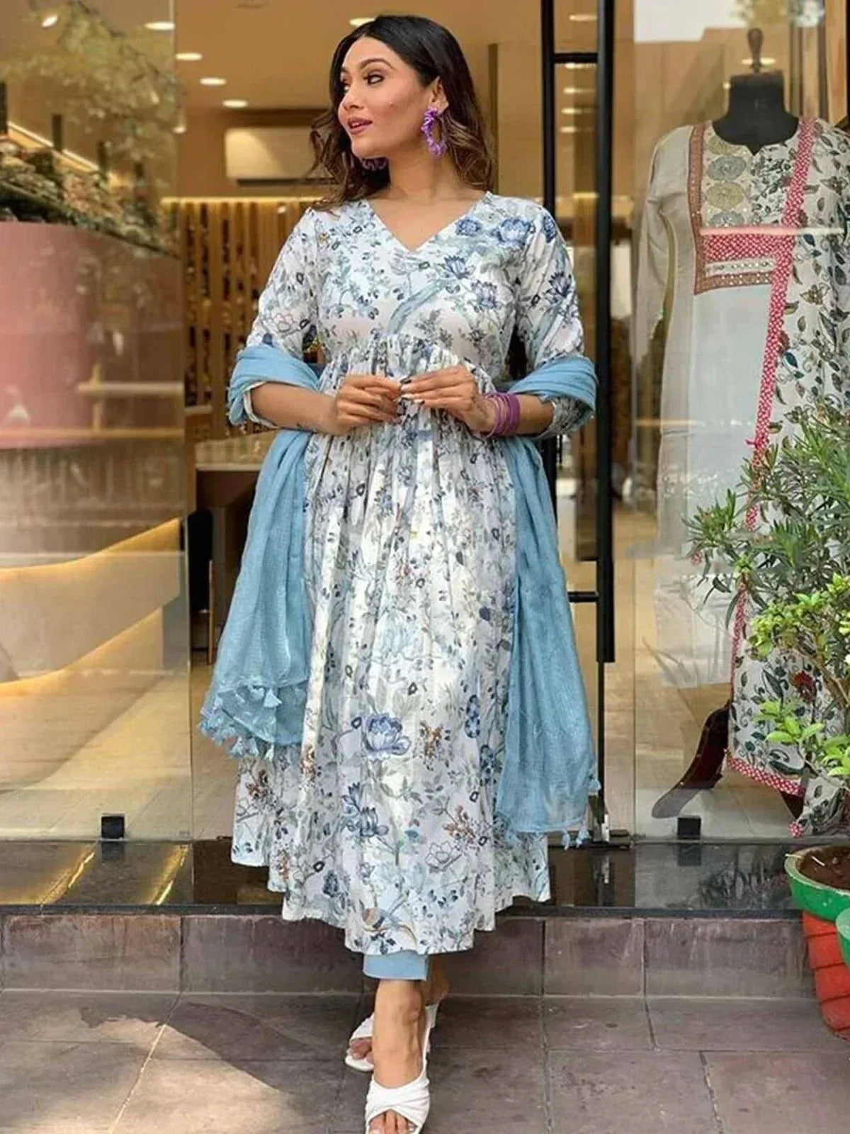 Woman in floral print Indian ethnic kurti with blue dupatta, stylish salwar kameez outfit