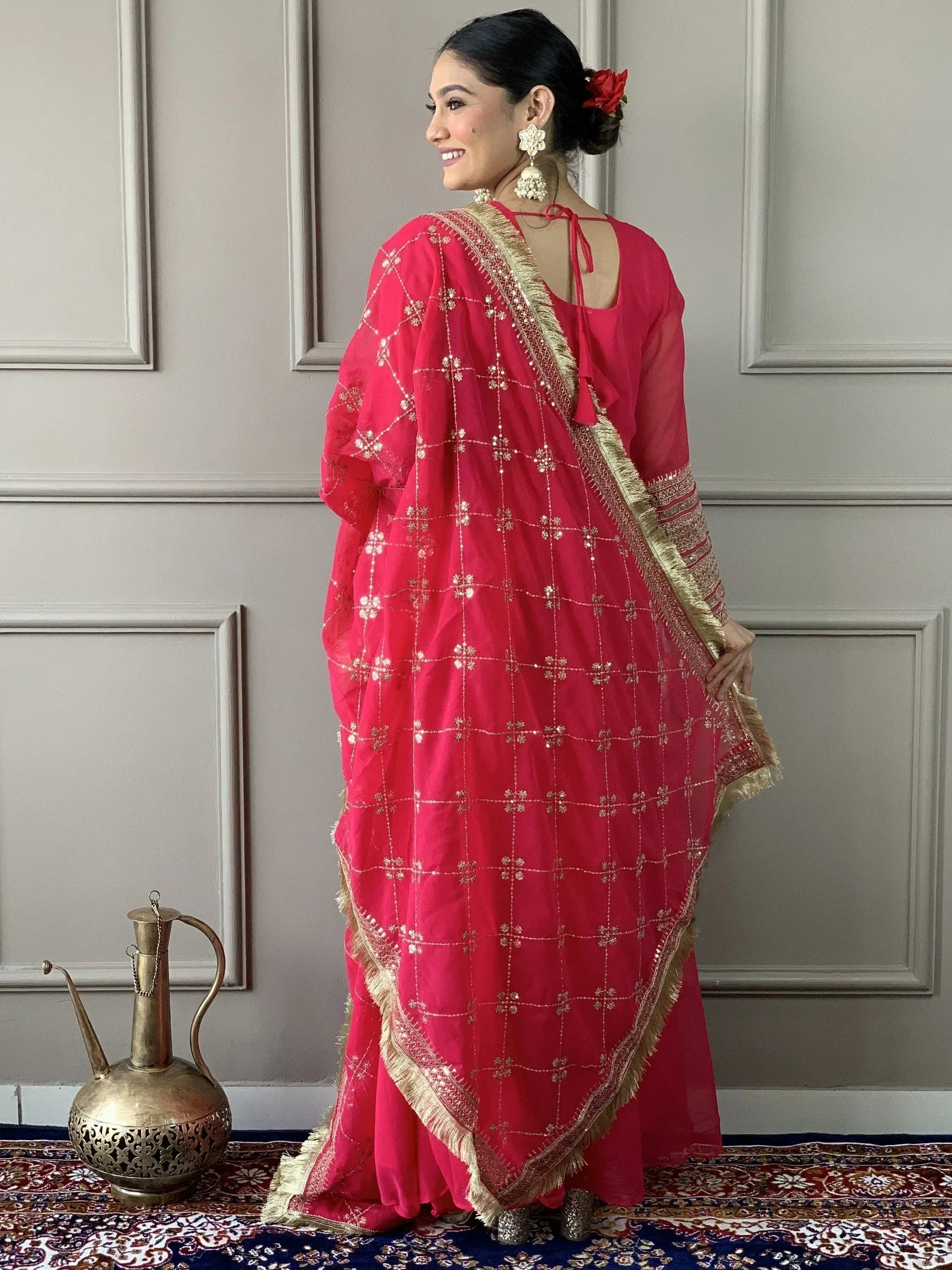 Pink embroidered salwar kameez with gold detailing, perfect for Indian ethnic wear occasions